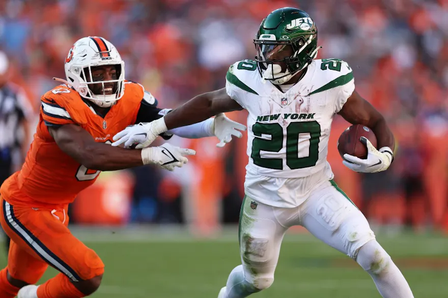 Breece Hall of the New York Jets runs with the ball while being chased by Jonathon Cooper #0 of the Denver Broncos as we look at our NFL prop picks for Week 9.