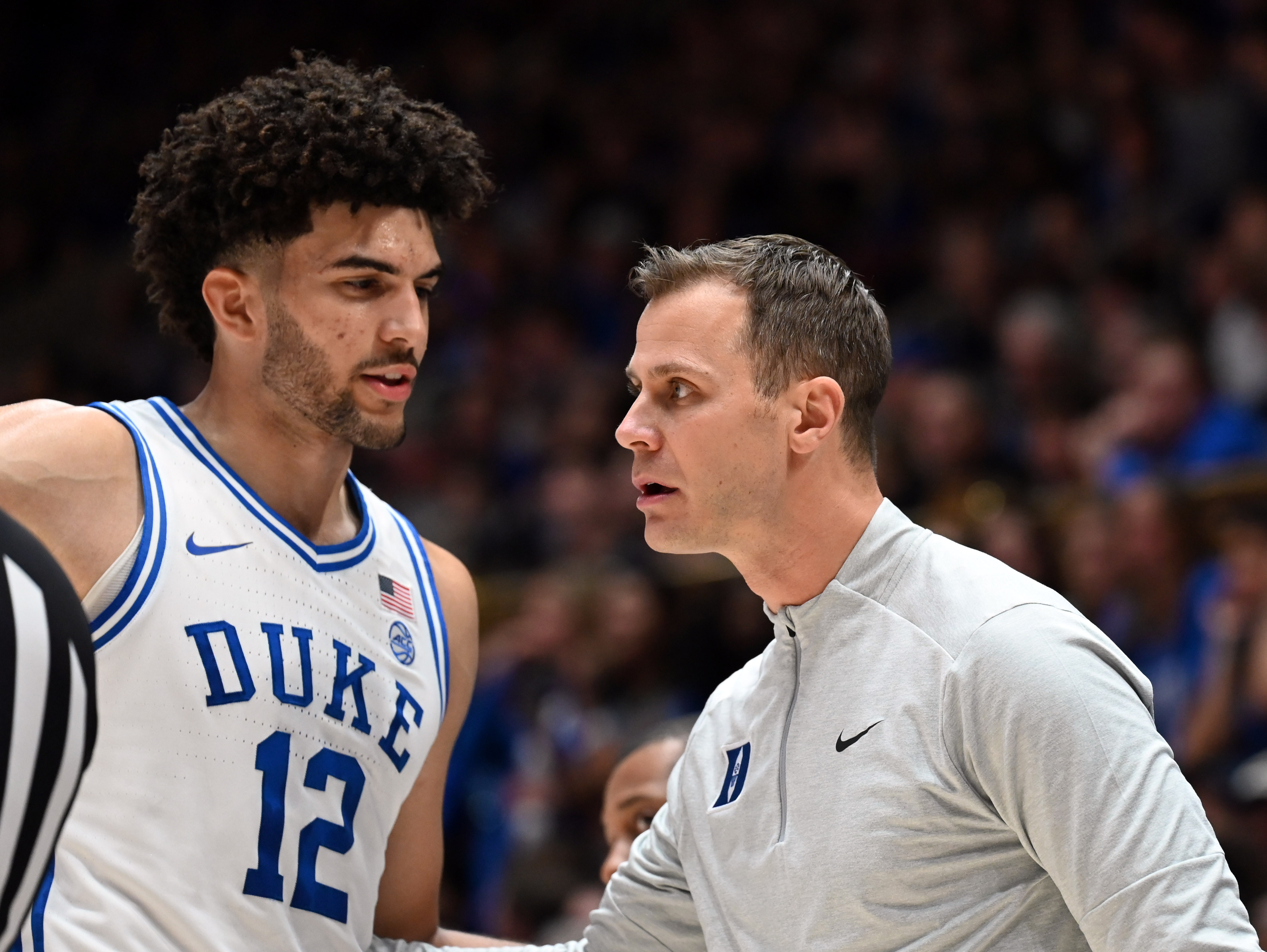 Duke Blue Devils forward Cameron Boozer (12) talks to head coach Jon Scheyer as we offer our college basketball predictions and best bets tonight.