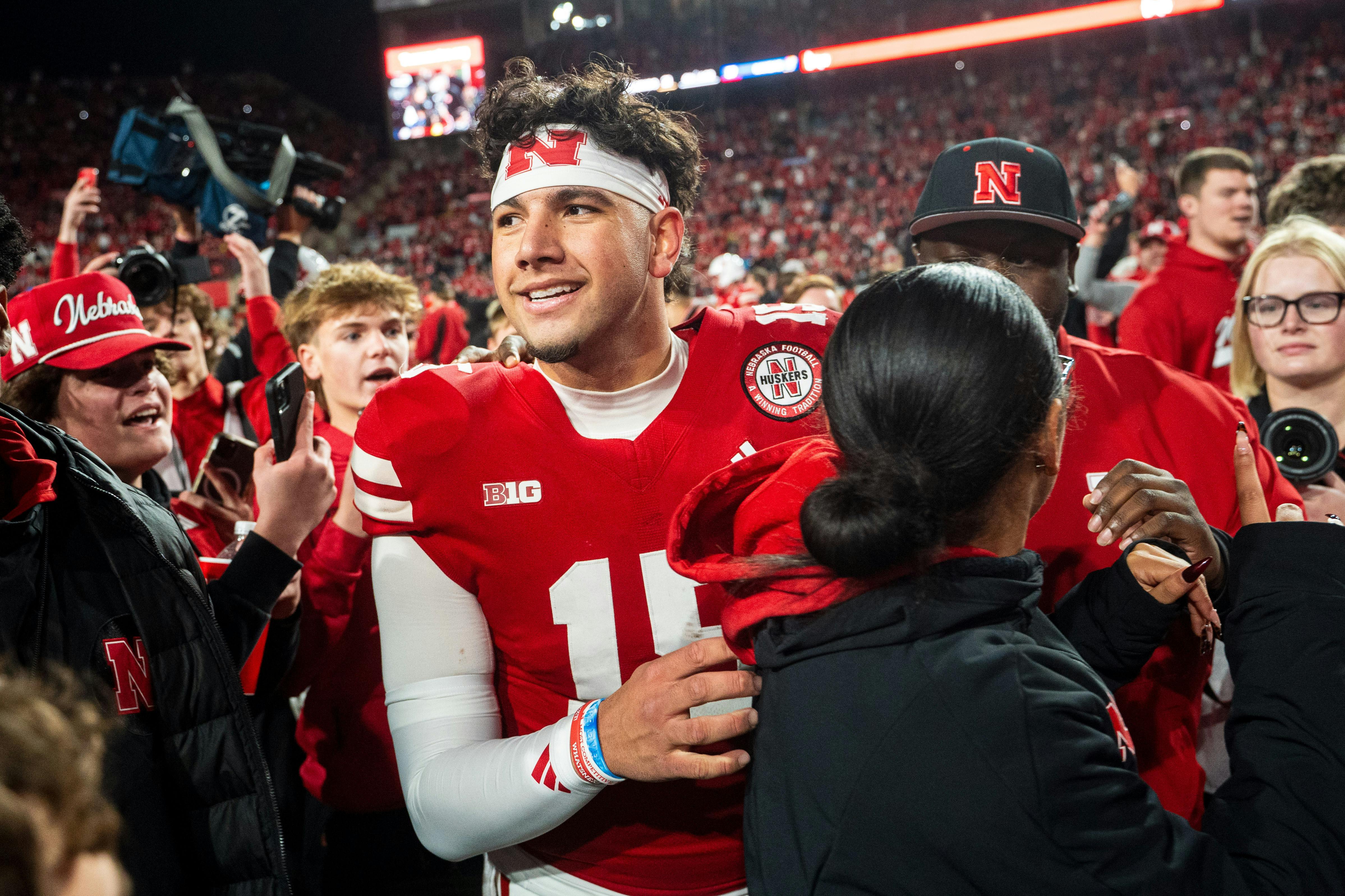 Nebraska Cornhuskers quarterback Dylan Raiola walks off as fans rush the field as we analyze the 2026 national championship odds.