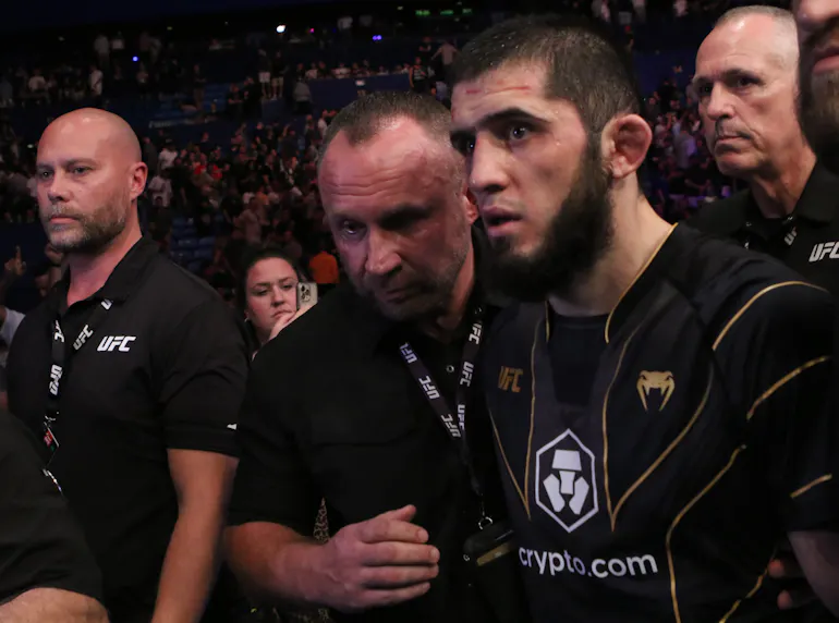 Islam Makhachev celebrates after defeating Alexander Volkanovski for the lightweight championship as we make our UFC 311 predictions.