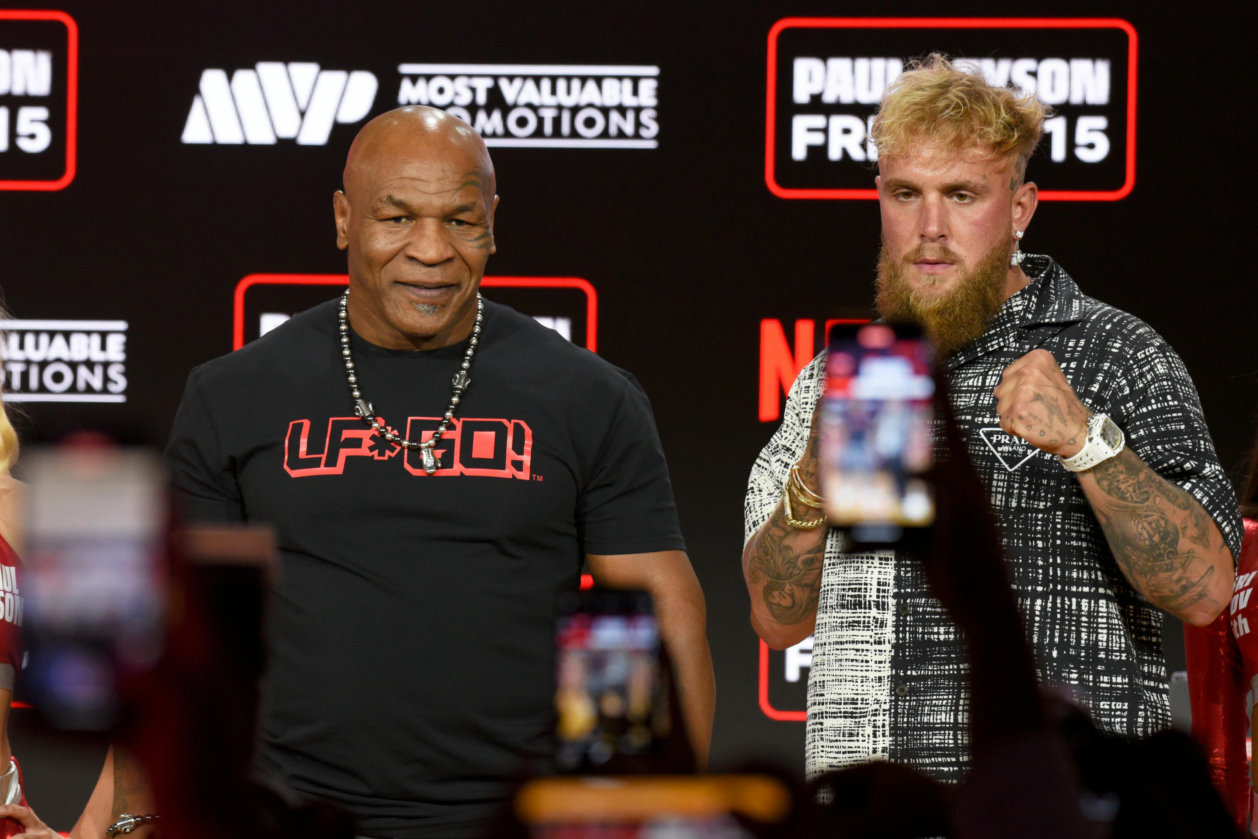 Mike Tyson and Jake Paul face off at boxing fight press conference at Fanatics Fest NYC 2024 at Javits Center in New York, NY.