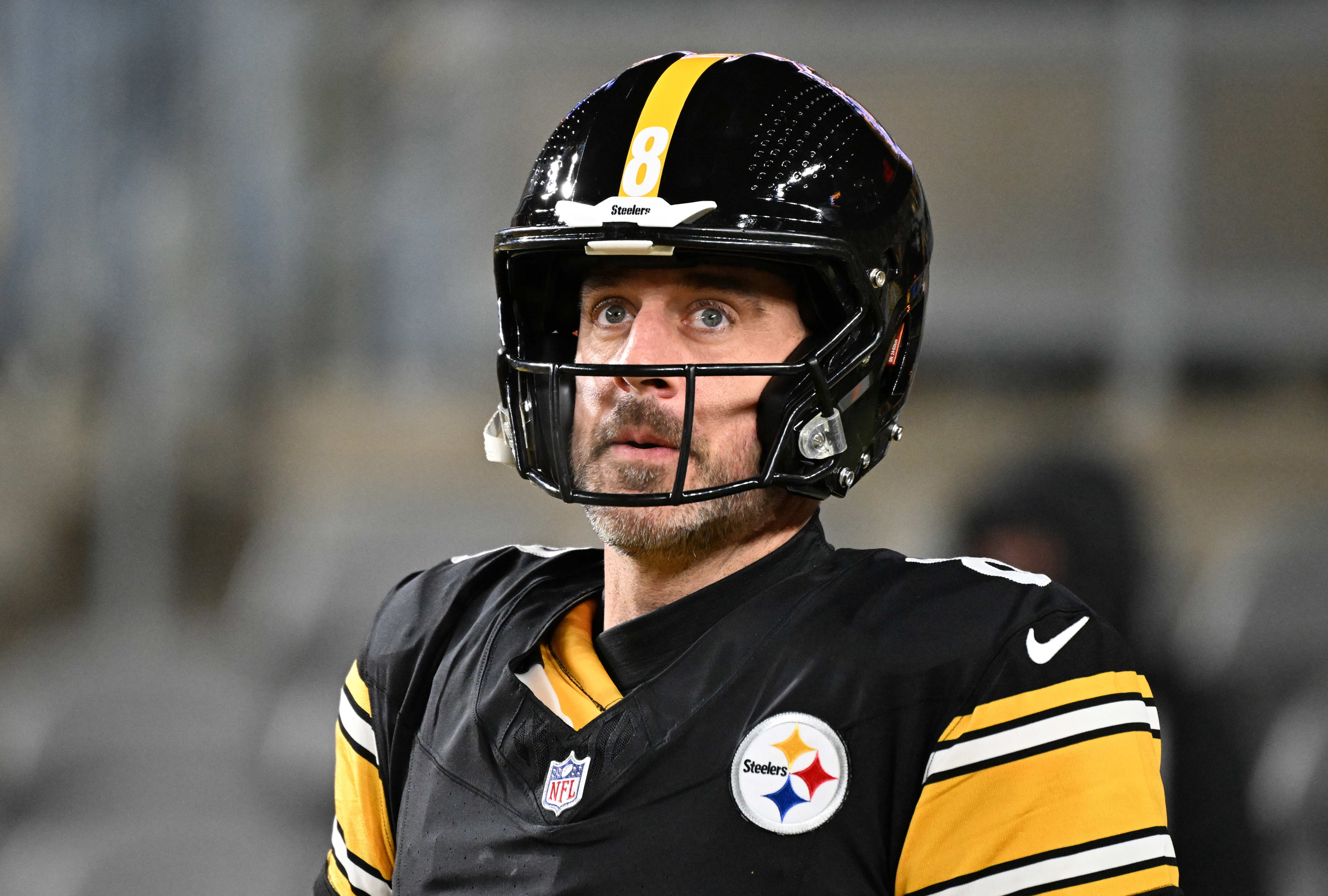 Pittsburgh Steelers quarterback Aaron Rodgers (8) warms up as we break down whether Aaron Rodgers will retire or play next season according to the latest odds from prediction markets.