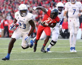 Anthony Watkins of the Tulsa Golden Hurricane runs with the ball against the Cincinnati Bearcats as we look at our Temple-Tulsa prediction.