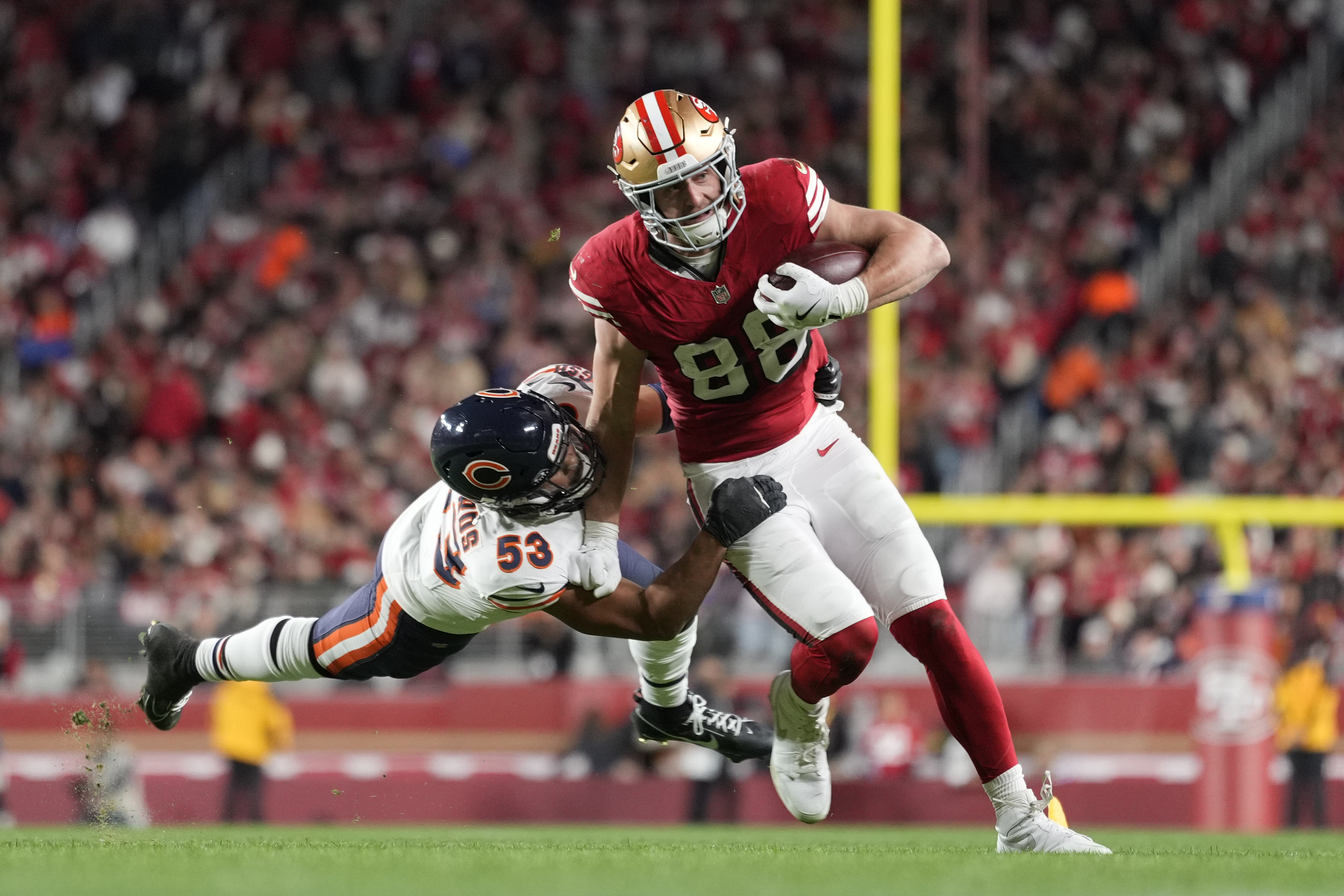 Chicago Bears linebacker T.J. Edwards (53) tackles San Francisco 49ers tight end Jake Tonges (88) in the second half at Levi's Stadium.