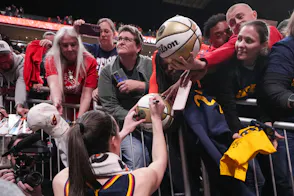 Indiana Fever guard Caitlin Clark (22) signs autographs for fans as we look at the Indiana sports betting revenue report for May.