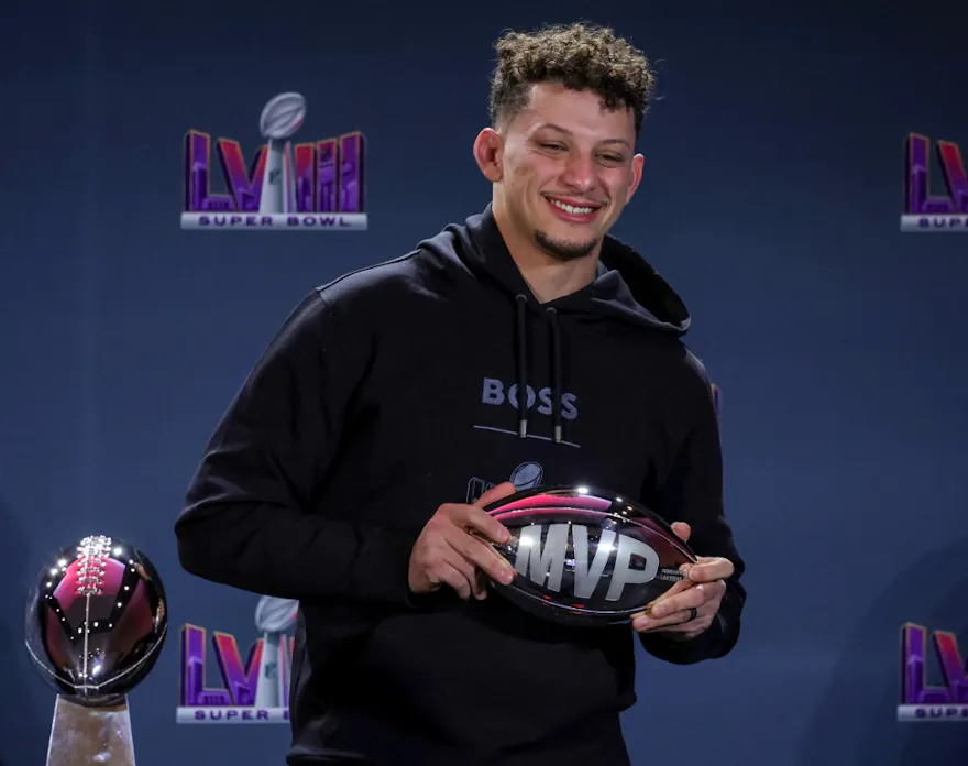 Quarterback Patrick Mahomes #15 of the Kansas City Chiefs poses with the MVP award as we look at the 2025 Super Bowl MVP odds.