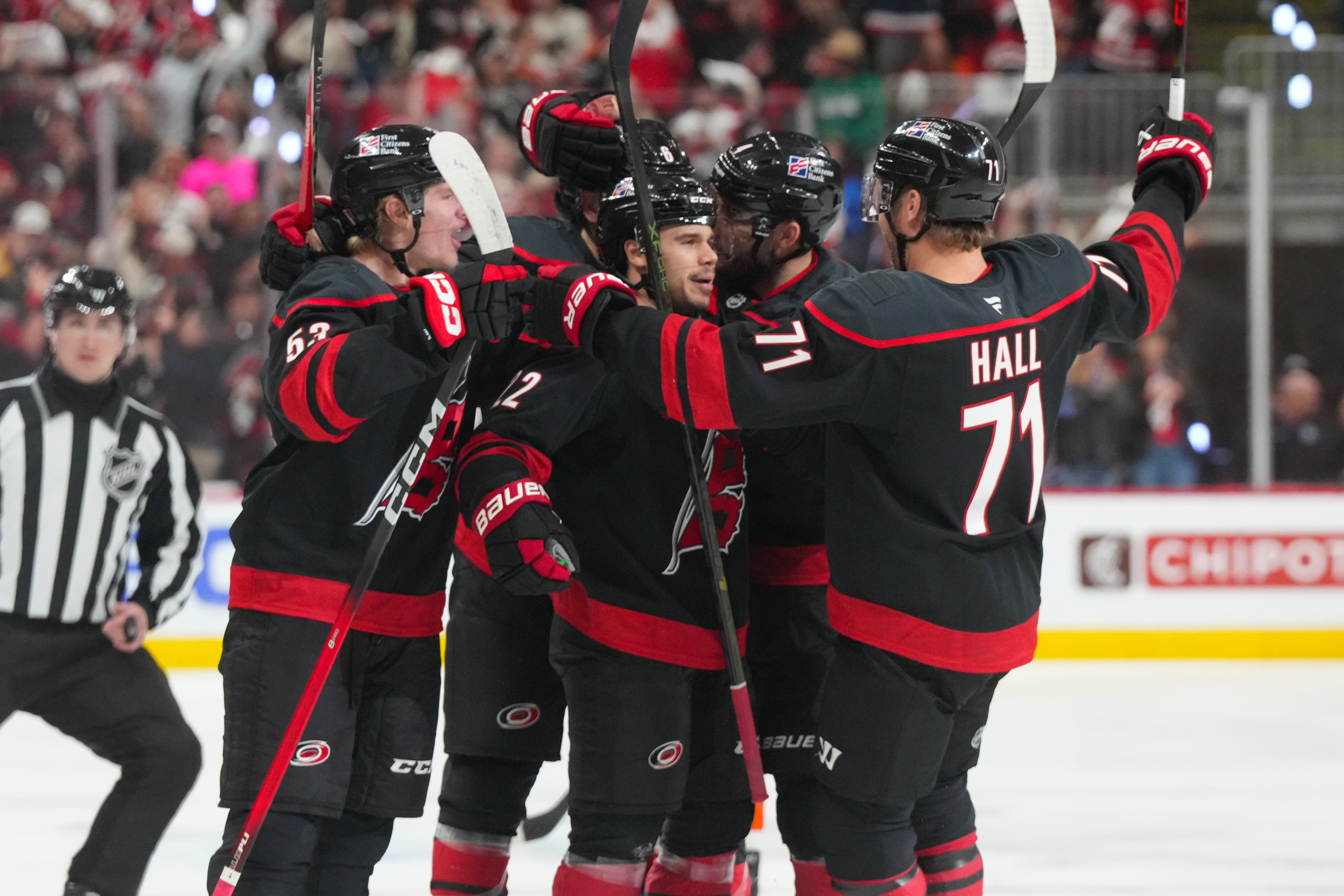 Taylor Hall and Carolina celebrates as we offer our Flyers vs. Hurricanes prediction and odds. 