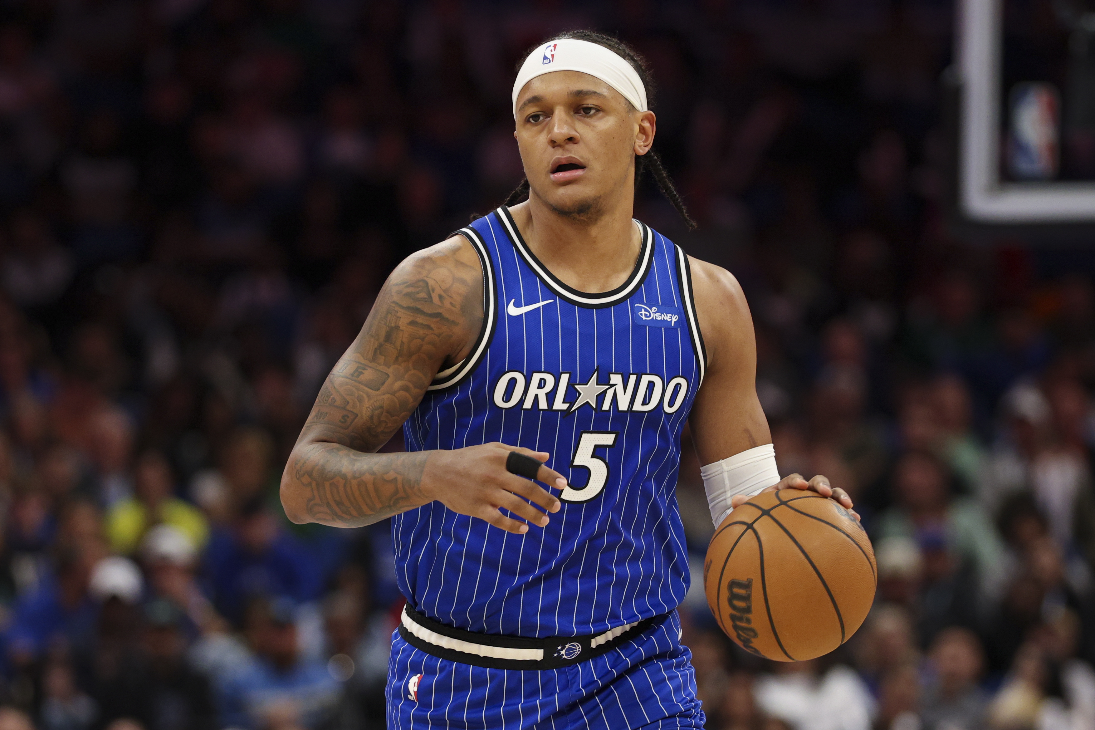 Orlando Magic forward Paolo Banchero (5) controls the ball as we break down the NBA Play-In Tournament odds 2026.