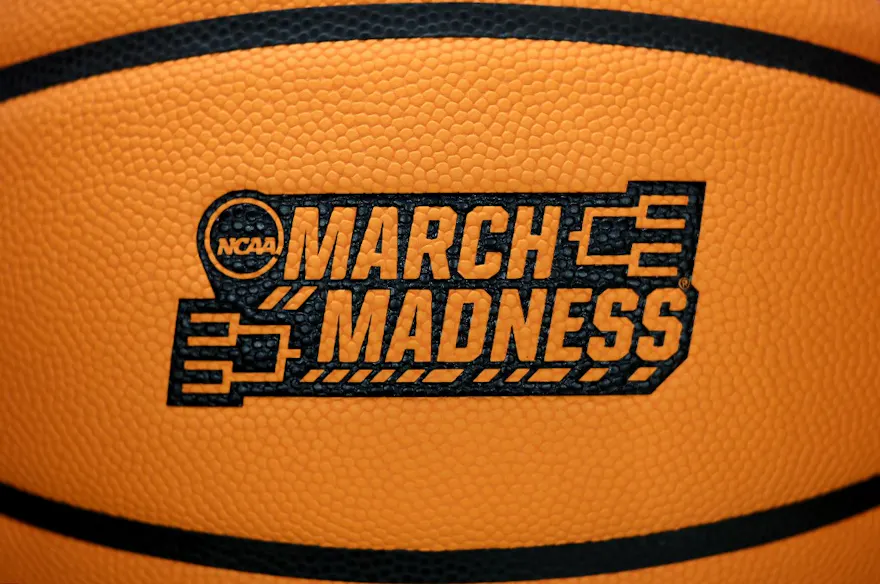 A detailed view of a basketball with a March Madness logo as we look at the best March Madness betting promos and boosts for Thursday