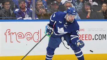 Auston Matthews #34 of the Toronto Maple Leafs grabs a puck as we look at the best 2024 Rocket Richard Trophy odds.