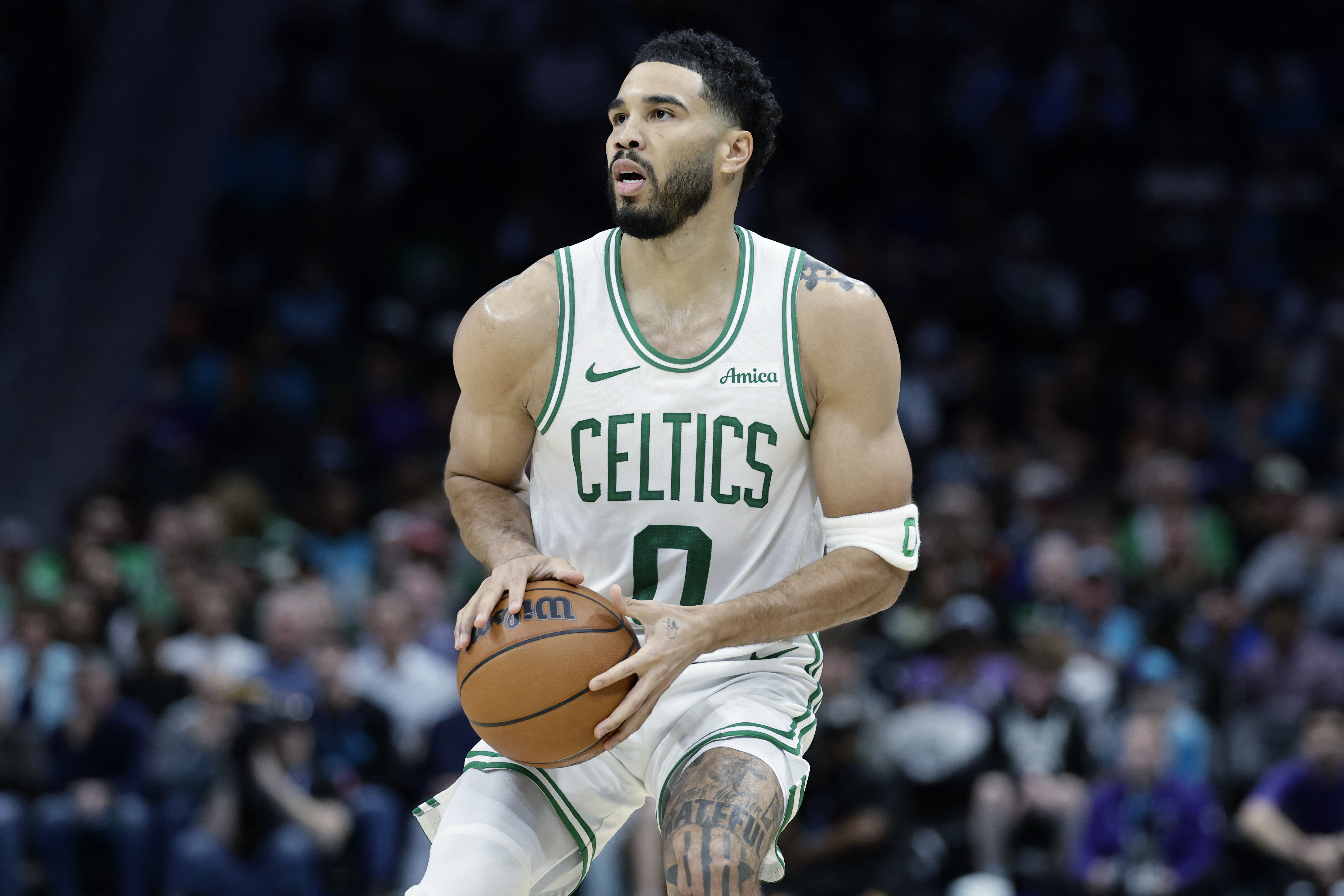 Boston Celtics forward Jayson Tatum (0), seen here preparing to attempt a jumpshot, is featured in our Hornets vs. Celtics player props tonight.
