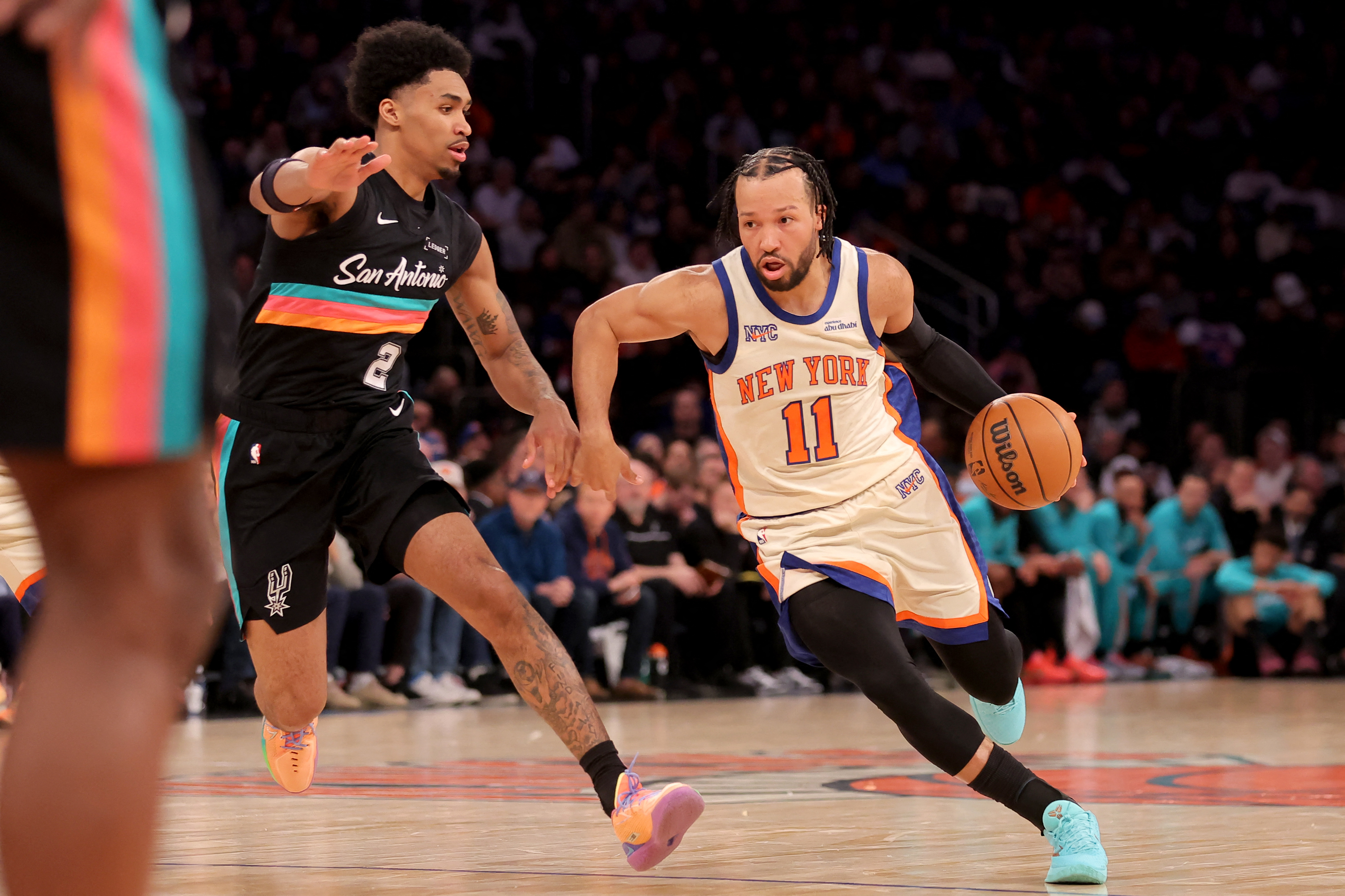 New York Knicks guard Jalen Brunson (11) drives to the basket against San Antonio Spurs guard Dylan Harper (2) at Madison Square Garden.