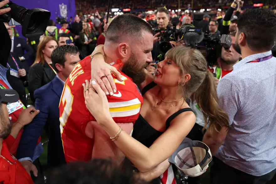 Travis Kelce of the Kansas City Chiefs kisses Taylor Swift following the 2024 Super Bowl, and we look at the top prop bets for the 2025 Super Bowl.