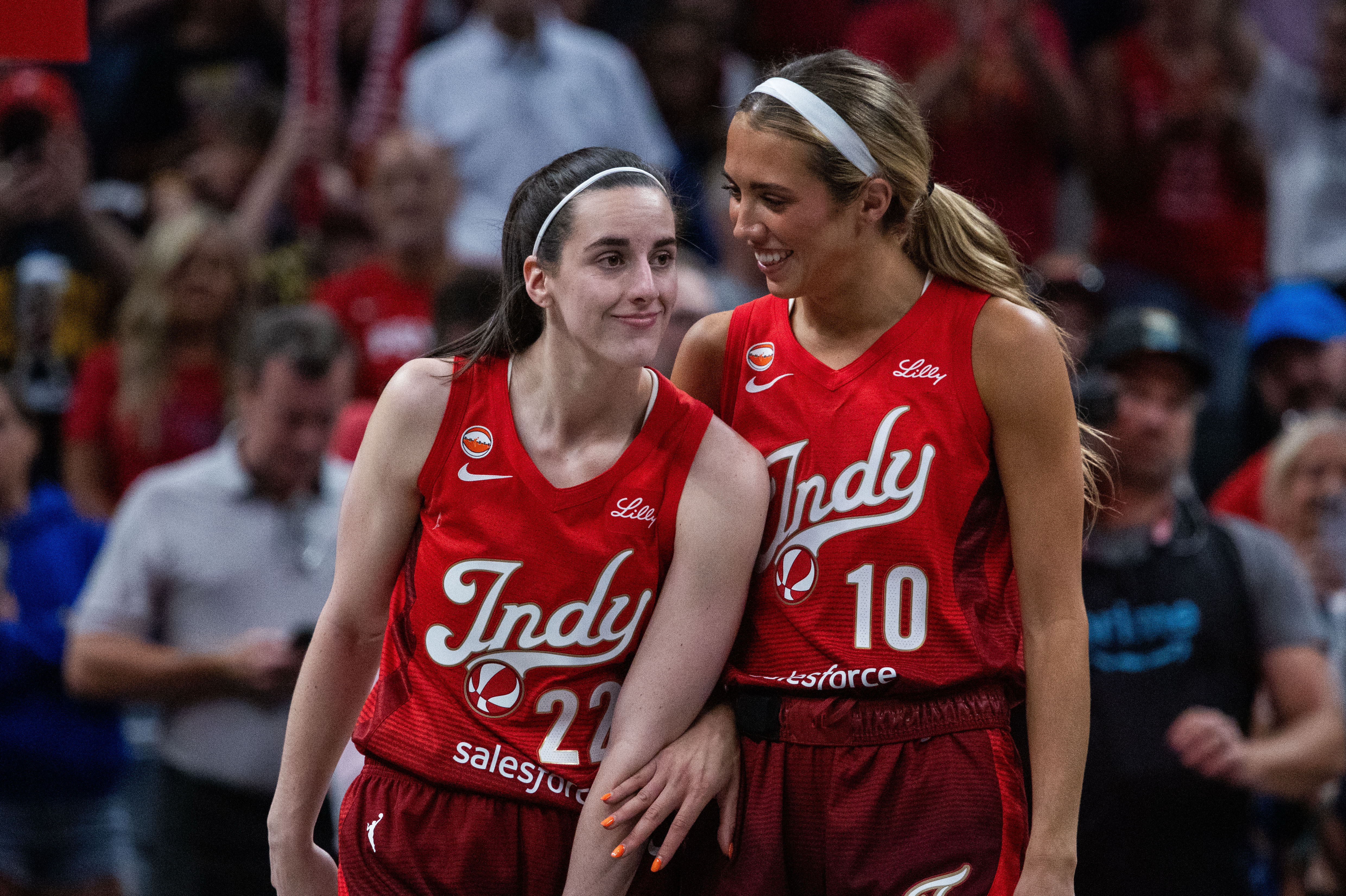 Indiana Fever guard Caitlin Clark reacts with guard Lexie Hull as we make our best Fever vs. Sky prediction.
