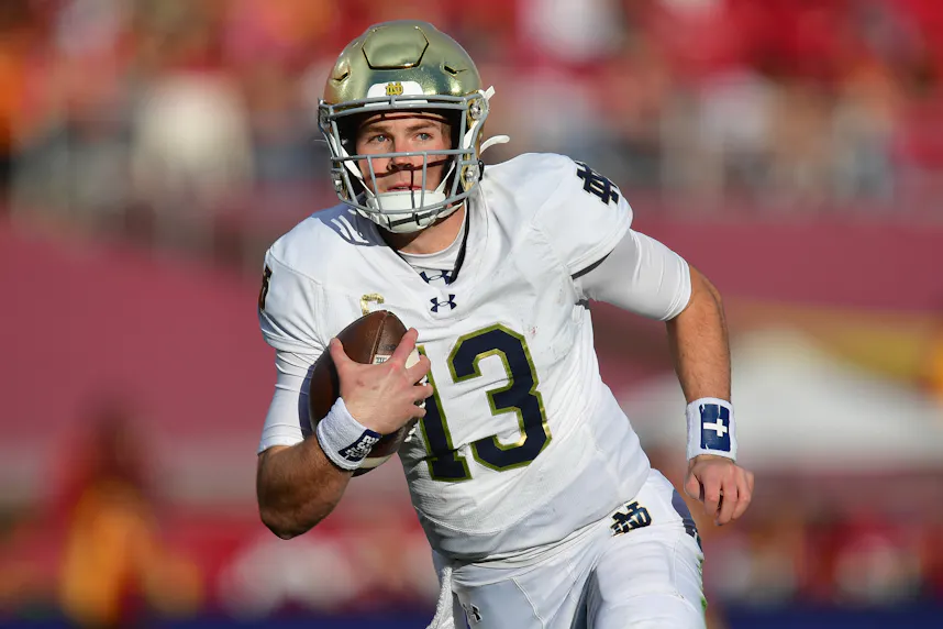 Notre Dame Fighting Irish quarterback Riley Leonard runs the ball as we make our Indiana vs. Notre Dame predictions for the College Football Playoff clash.