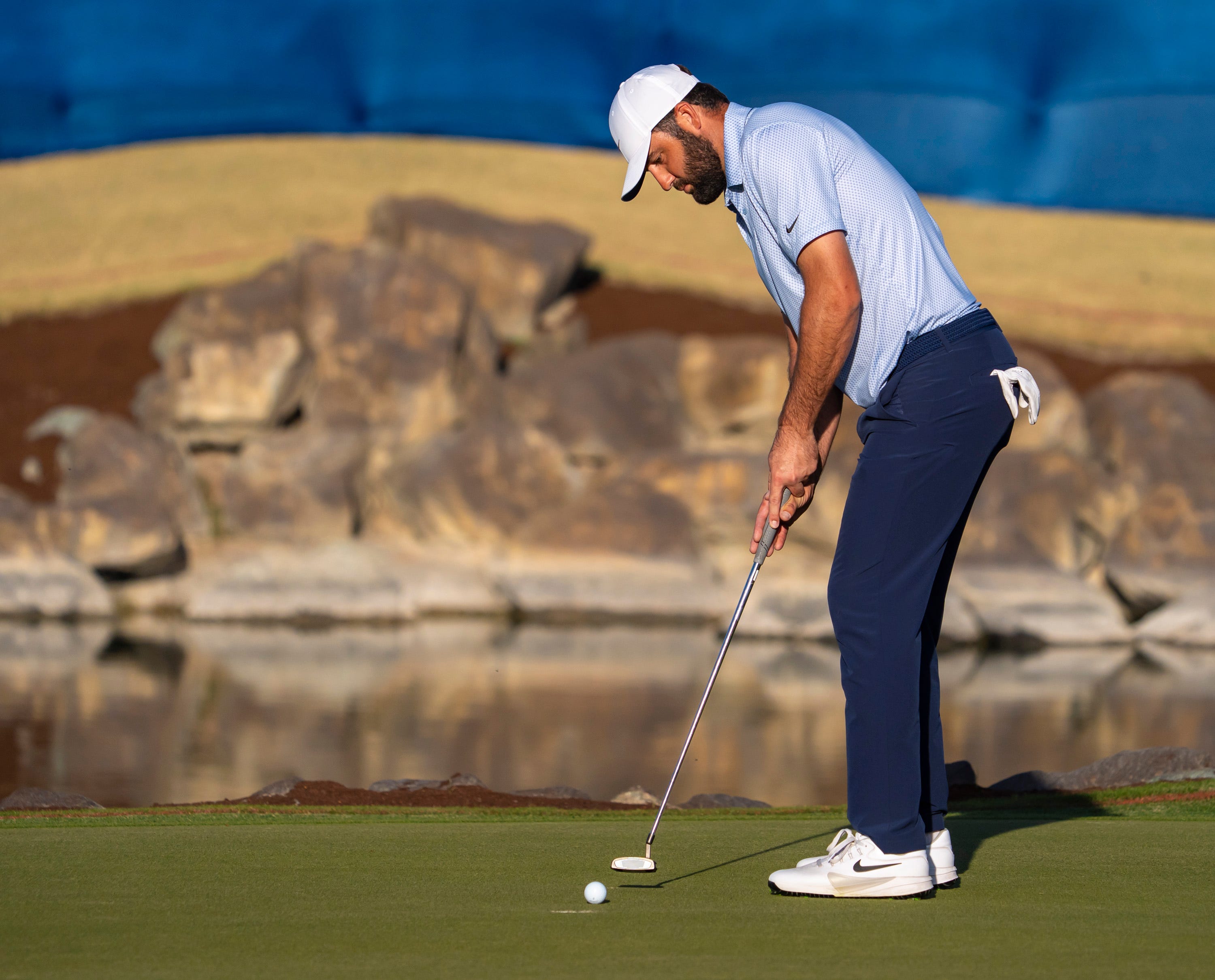 Scottie Scheffler putts for par on 18 of Pete Dye Stadium Course. 