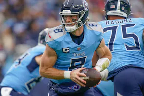 Tennessee Titans quarterback Will Levis looks to hand off as we look at the sports betting financials for Tennessee in November 2024