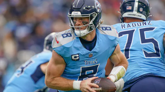 Tennessee Titans quarterback Will Levis looks to hand off as we look at the sports betting financials for Tennessee in November 2024