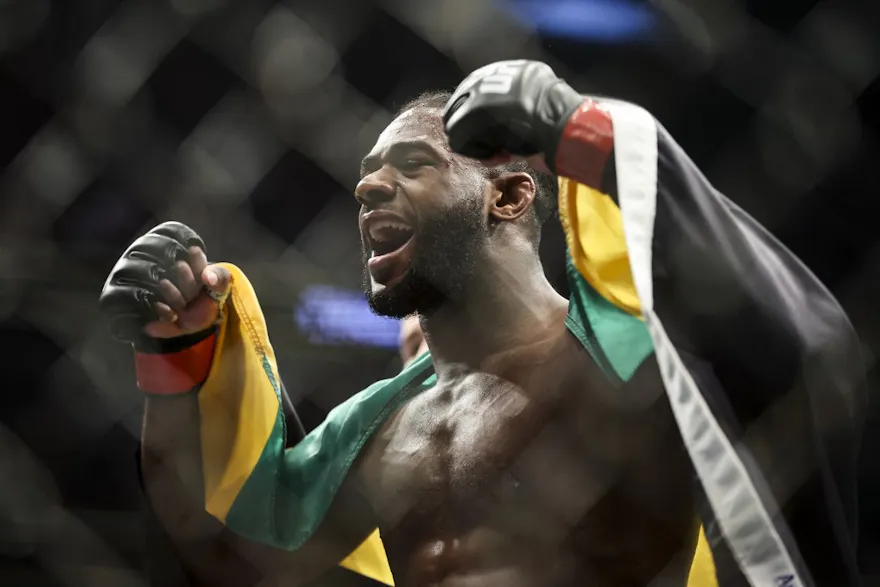 Aljamain Sterling celebrates after his UFC bantamweight championship fight against Petr Yan, and we offer new U.S. bettors our exclusive Caesars promo code for UFC 292.