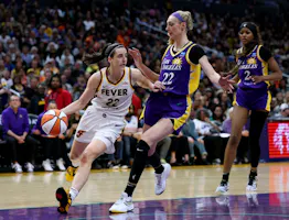 Caitlin Clark of the Indiana Fever dribbles in front of Cameron Brink and Rickea Jackson of the Los Angeles Sparks during a 78-73 Fever win at Crypto.com Arena. We're backing Brink in our Sparks vs. Fever Prediction. 