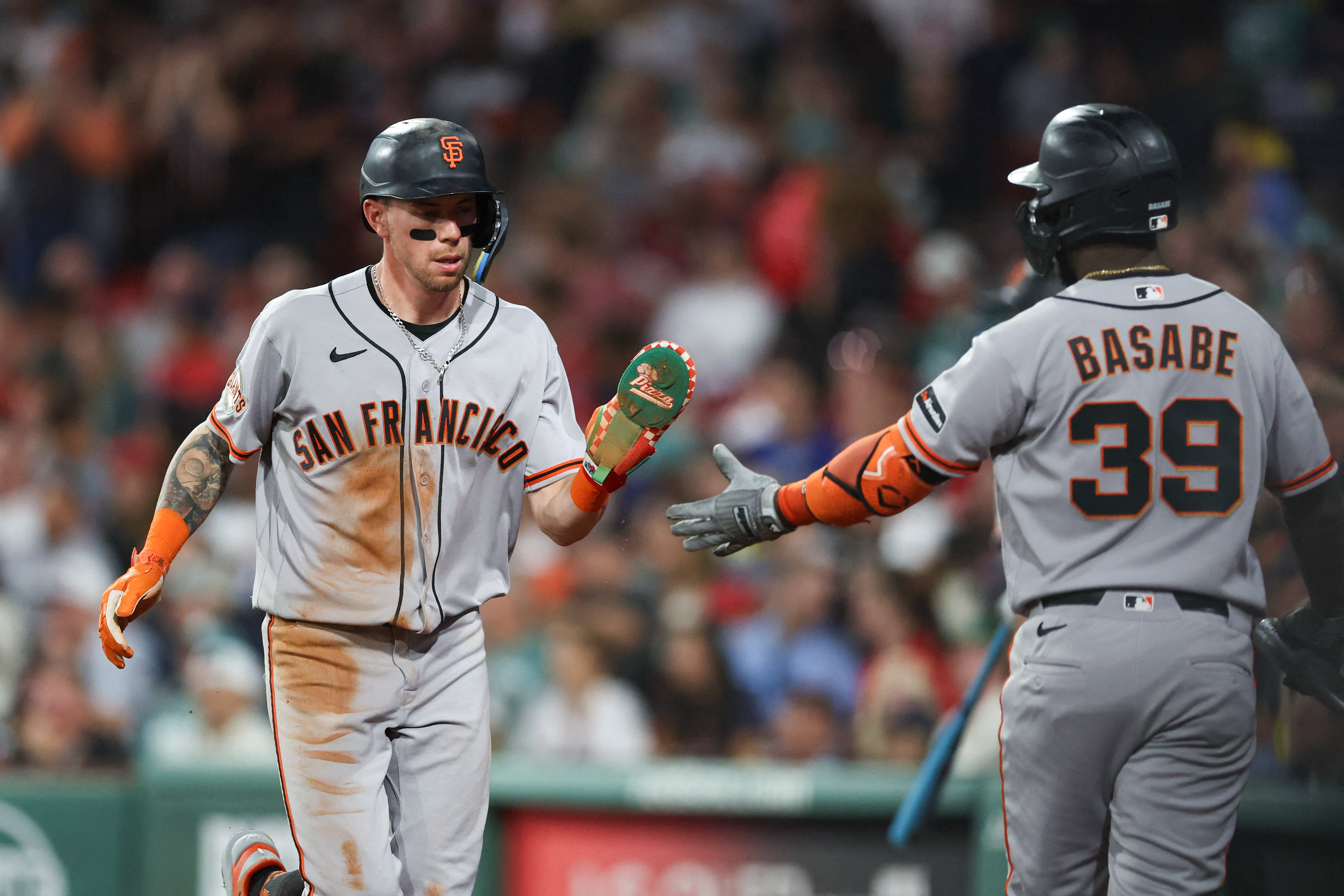 San Francisco Giants third baseman Christian Koss celebrates with second baseman Osleivis Basabe as we make our best Reds vs. Giants predictions