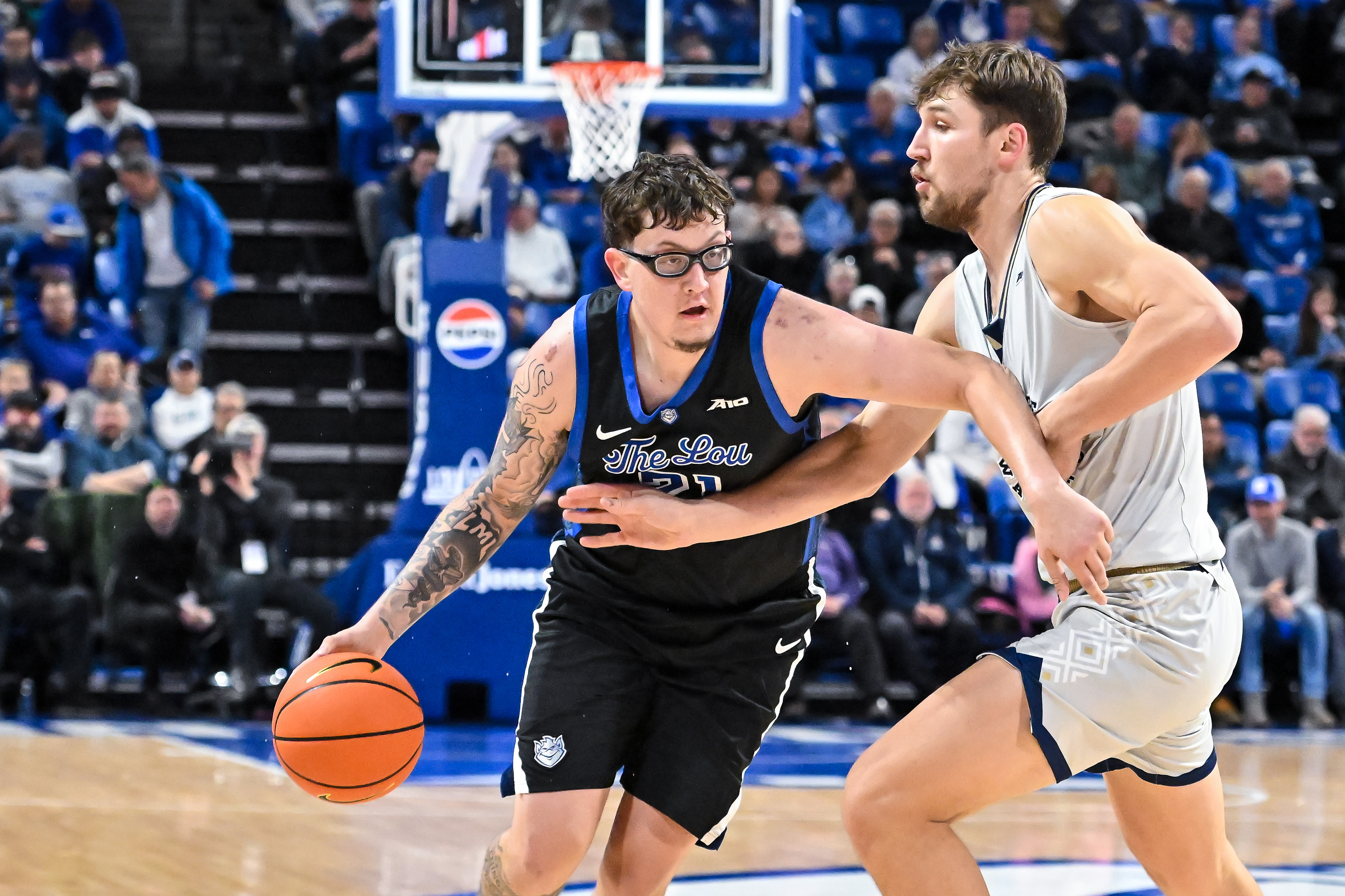 Saint Louis' Robbie Avila (21) is key to our college basketball predictions and best bets today. 