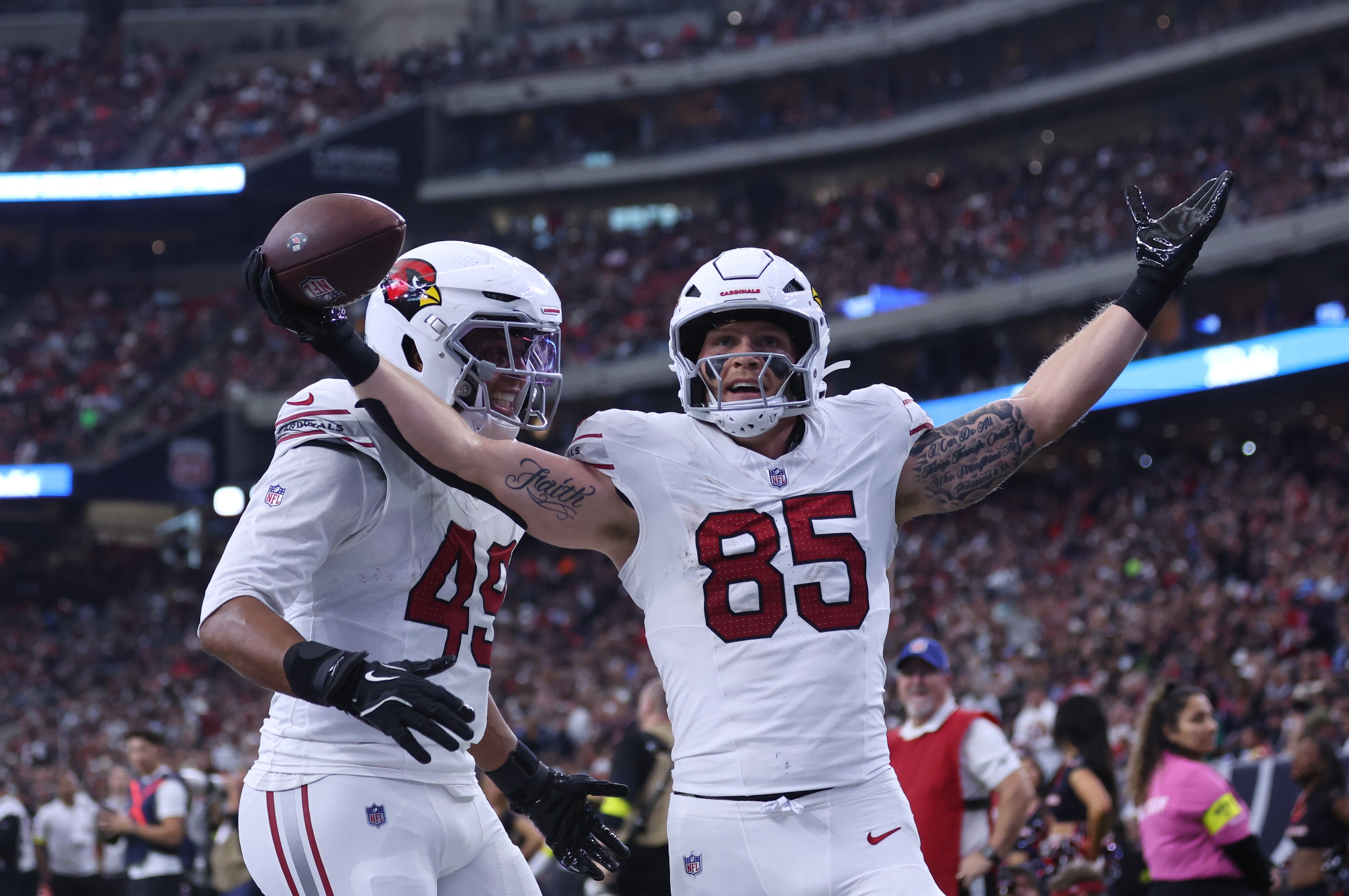 Trey McBride and Pharaoh Brown celebrate a touchdown as we offer our NFL best bets for Week 17. 