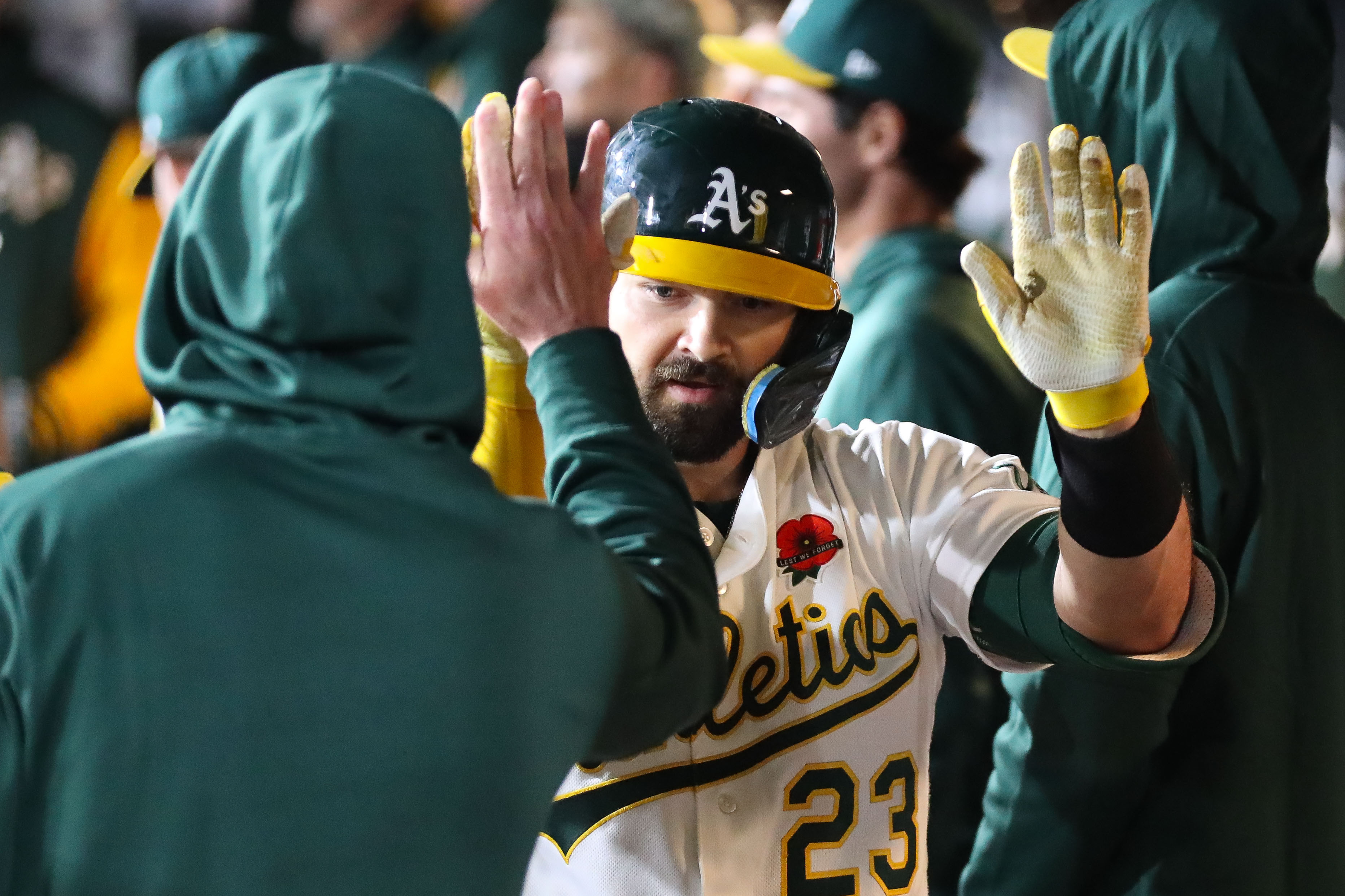 Athletics catcher Shea Langeliers celebrates in the dugout as we make our best home run predictions today.