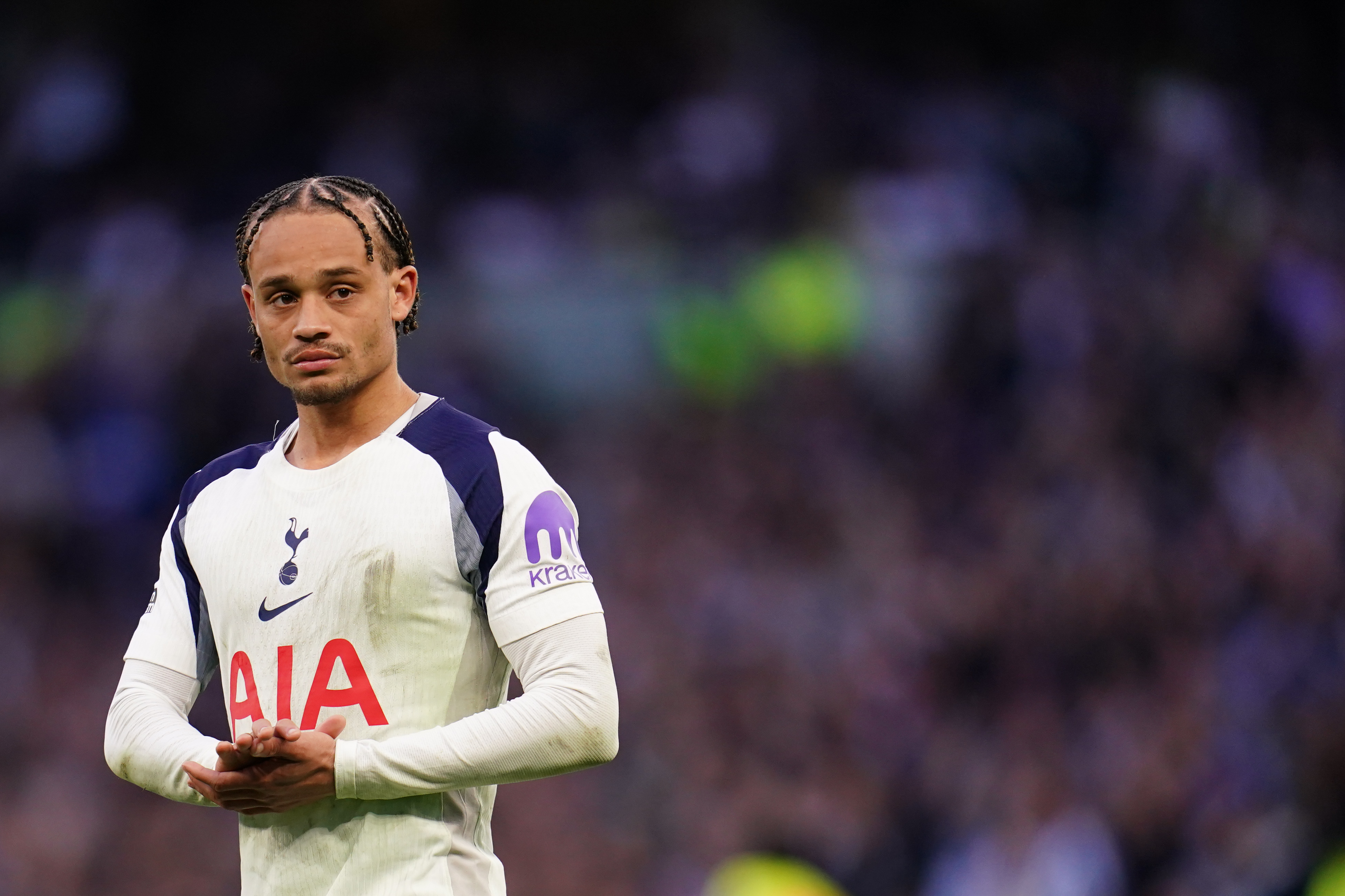 Xavi Simons of Tottenham Hotspur applauds home support at full time as we break down our Wolverhampton vs. Tottenham prediction.