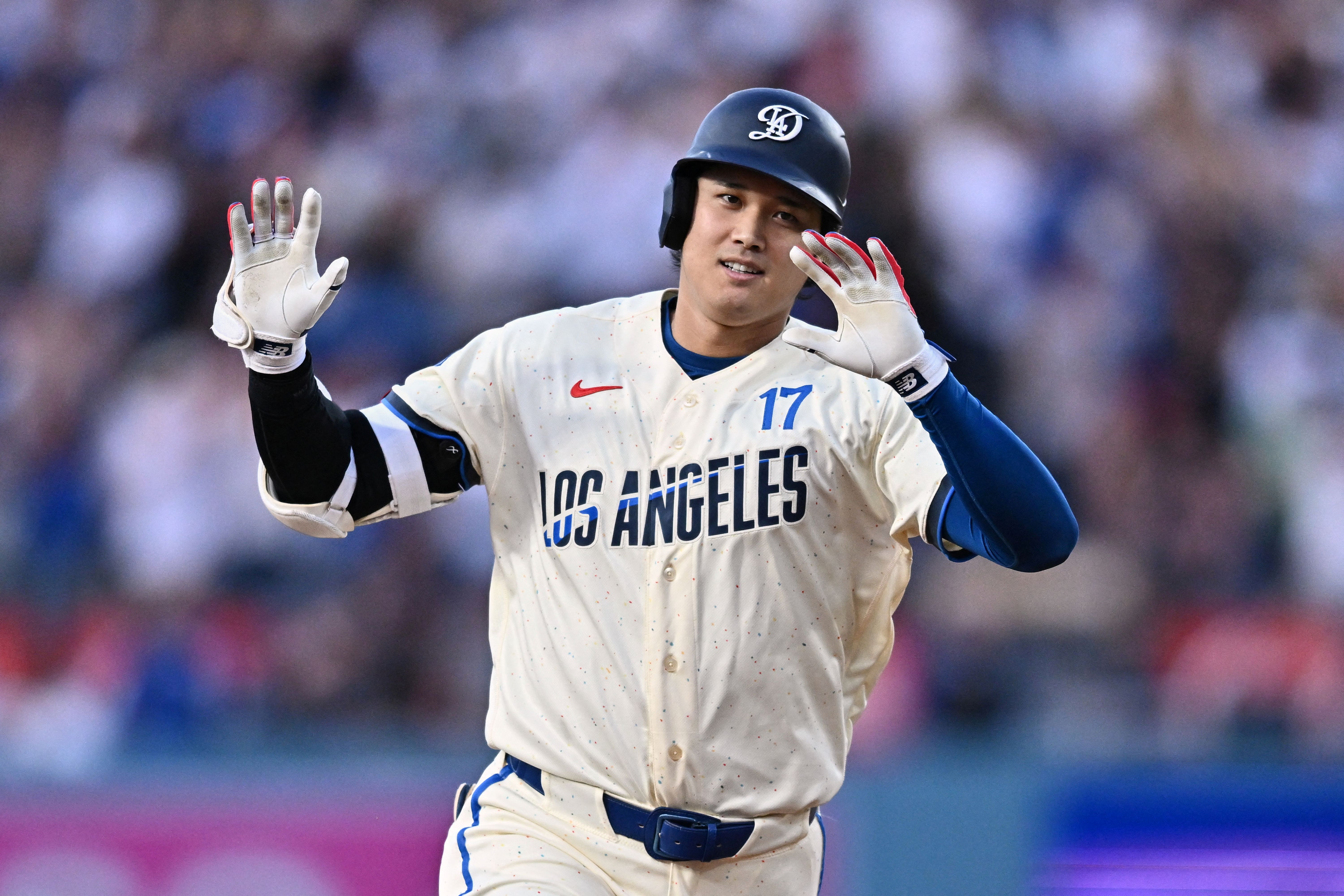  Los Angeles Dodgers designated hitter Shohei Ohtani acknowledges the dugout after hitting a two-run home run, and he's key to the World Series odds