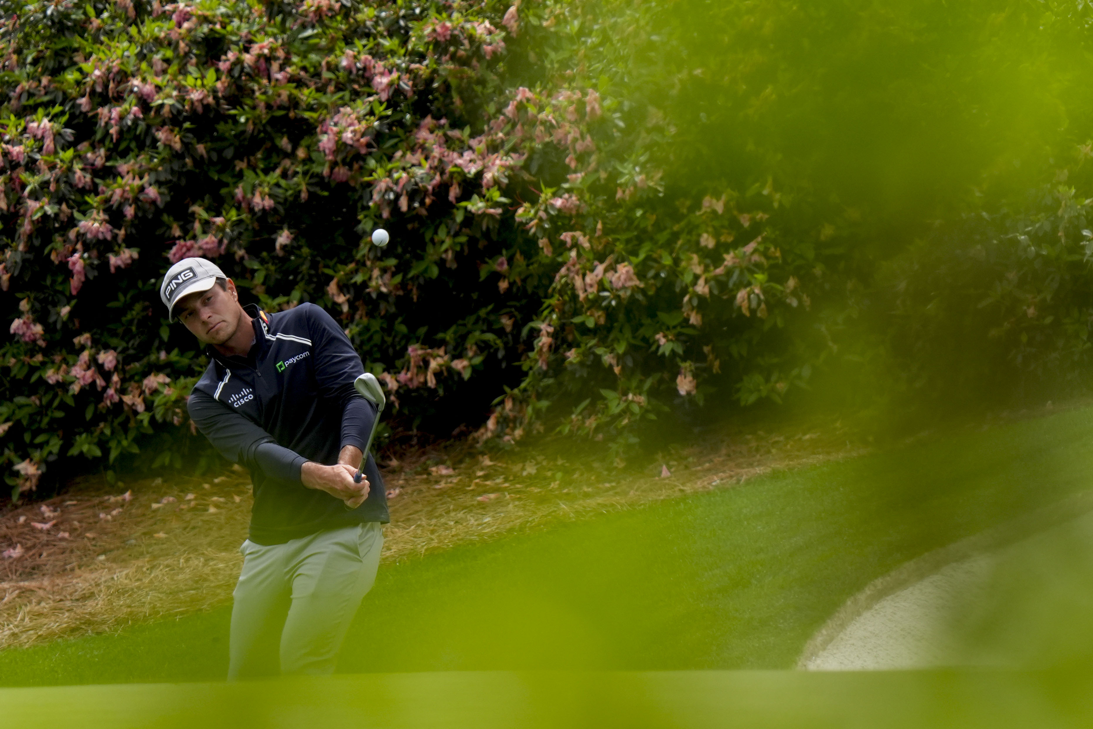 Viktor Hovland plays his shot on the 13th hole during a practice round for the Masters Tournament at Augusta National Golf Course