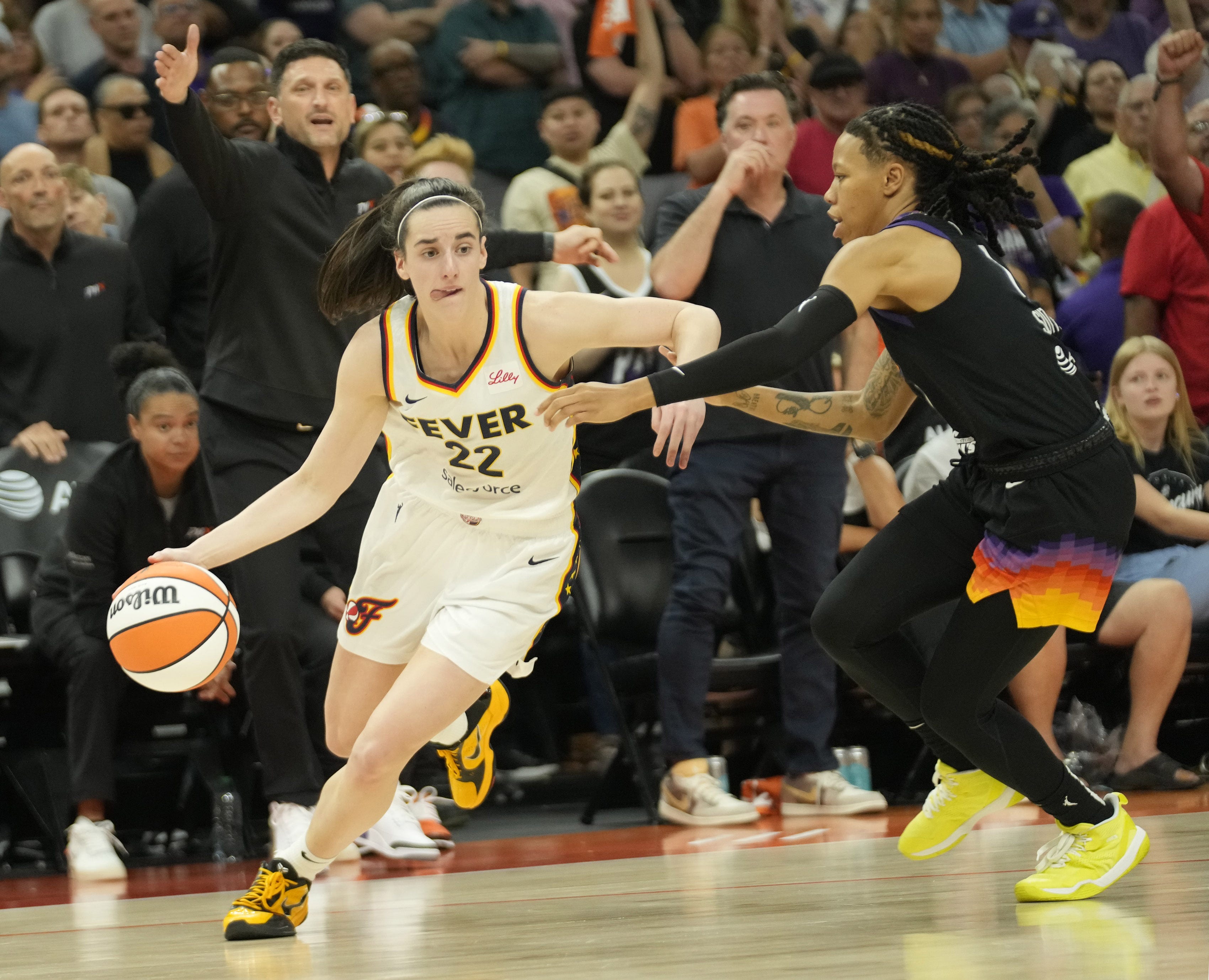 Indiana Fever guard Caitlin Clark (22) is fouled as we offer our best Mercury vs. Fever prediction and expert picks for Friday's WNBA matchup at Gainbrige Fieldhouse in Indianapolis.