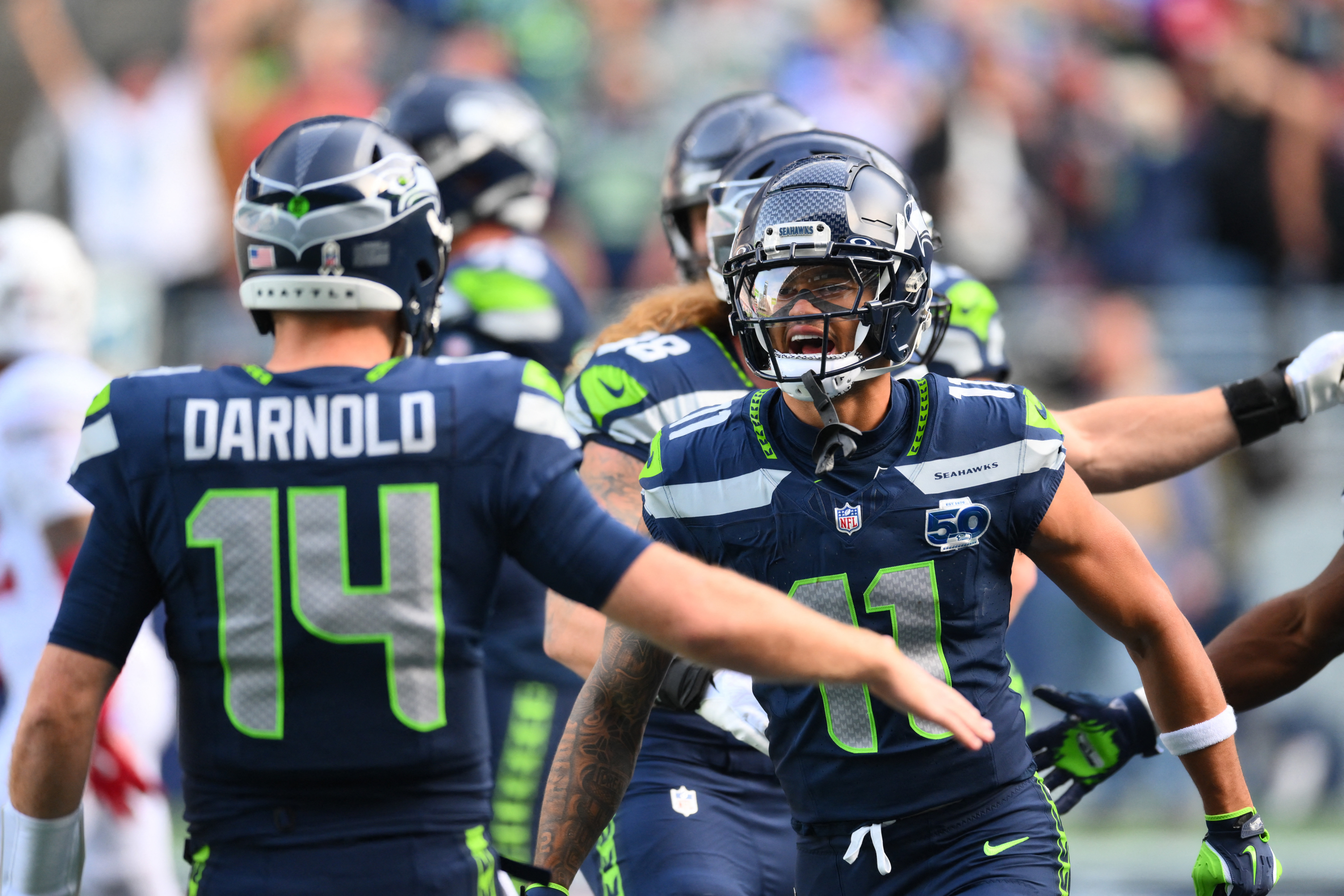 Seattle Seahawks wide receiver Jaxon Smith-Njigba (11) celebrates with quarterback Sam Darnold (14) as we offer our Seahawks vs. Patriots same‑game parlay for the Super Bowl.