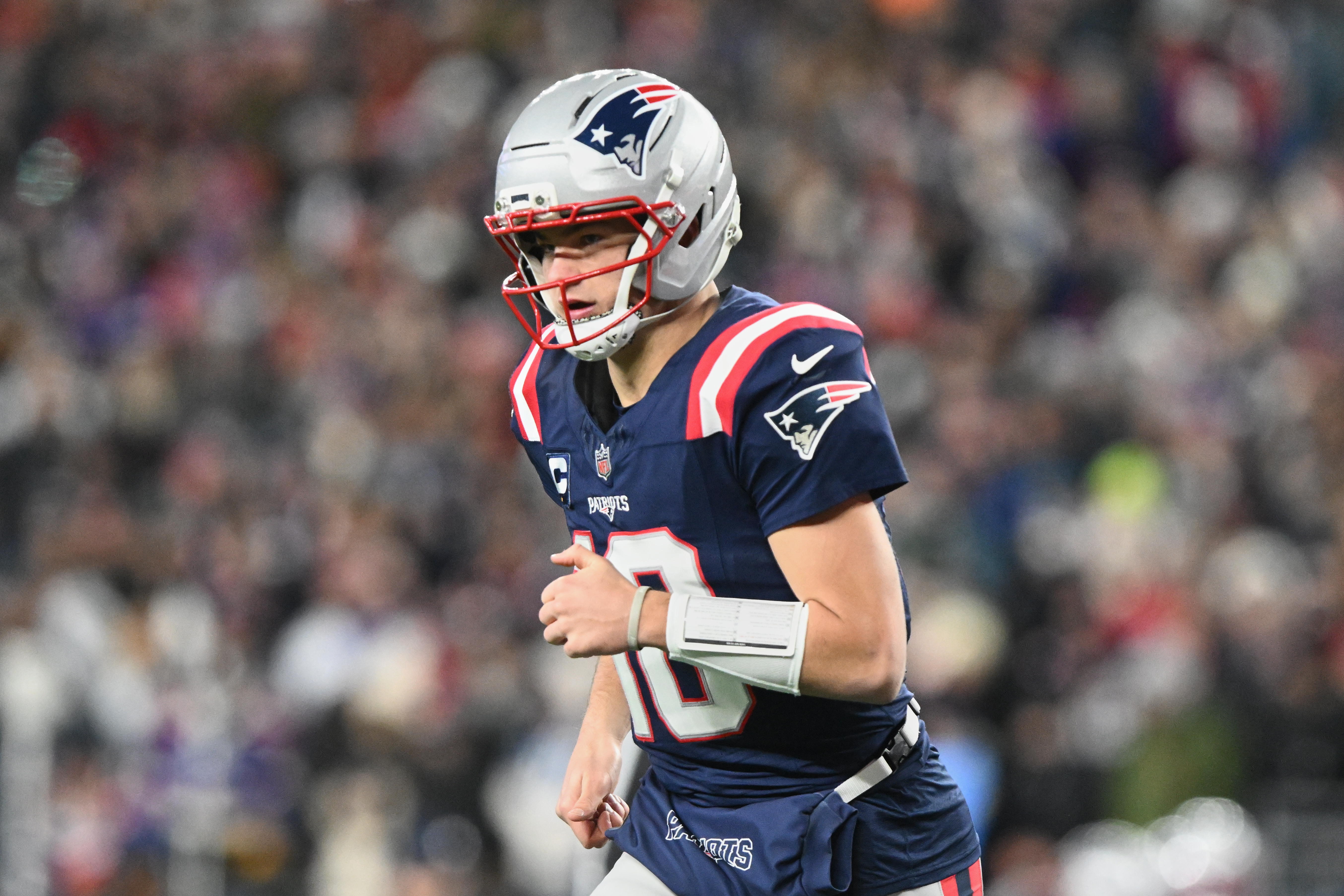 New England Patriots quarterback Drake Maye - who's featured in my Chargers vs. Patriots early prediction - runs off the field.