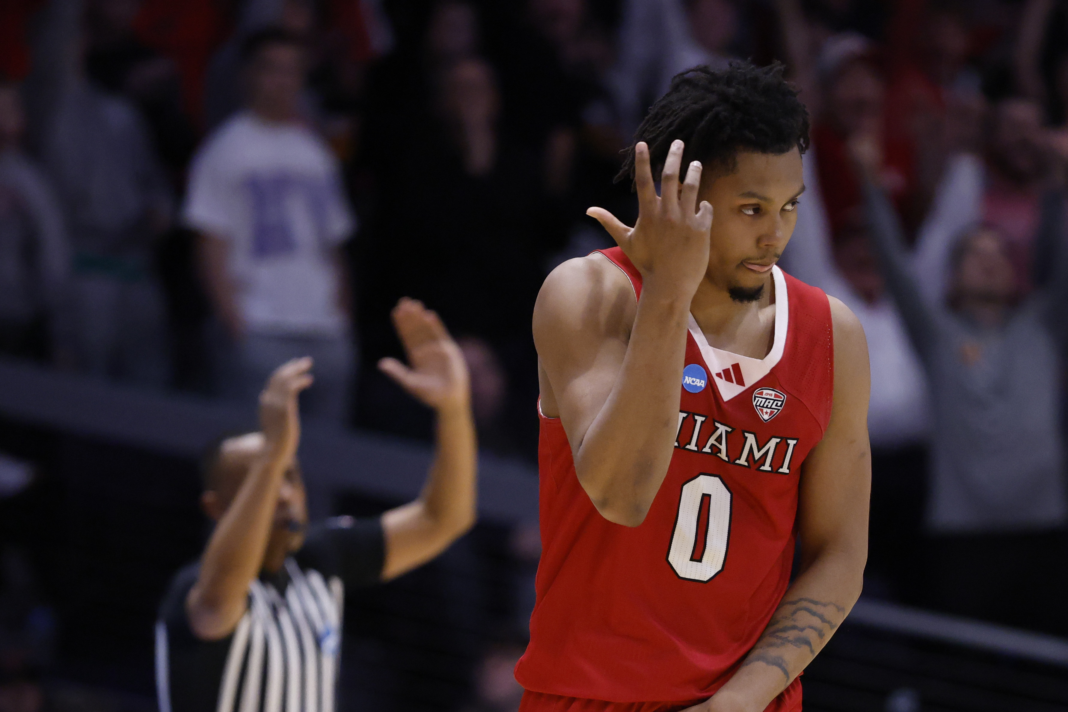 Miami (OH) RedHawks wing Eian Elmer (0), featured in our Miami (OH) vs. Tennessee prediction, reacts during a First Four game against SMU.