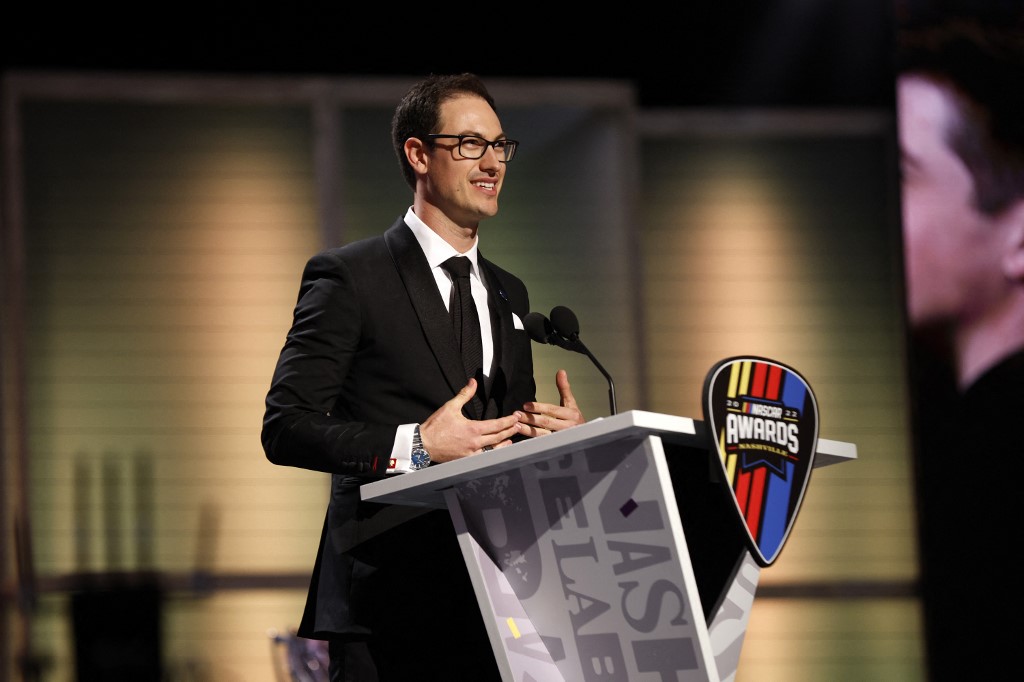 Joey Logano accepts an award at the NASCAR Awards and is a driver to watch by the Daytona 500 odds.
