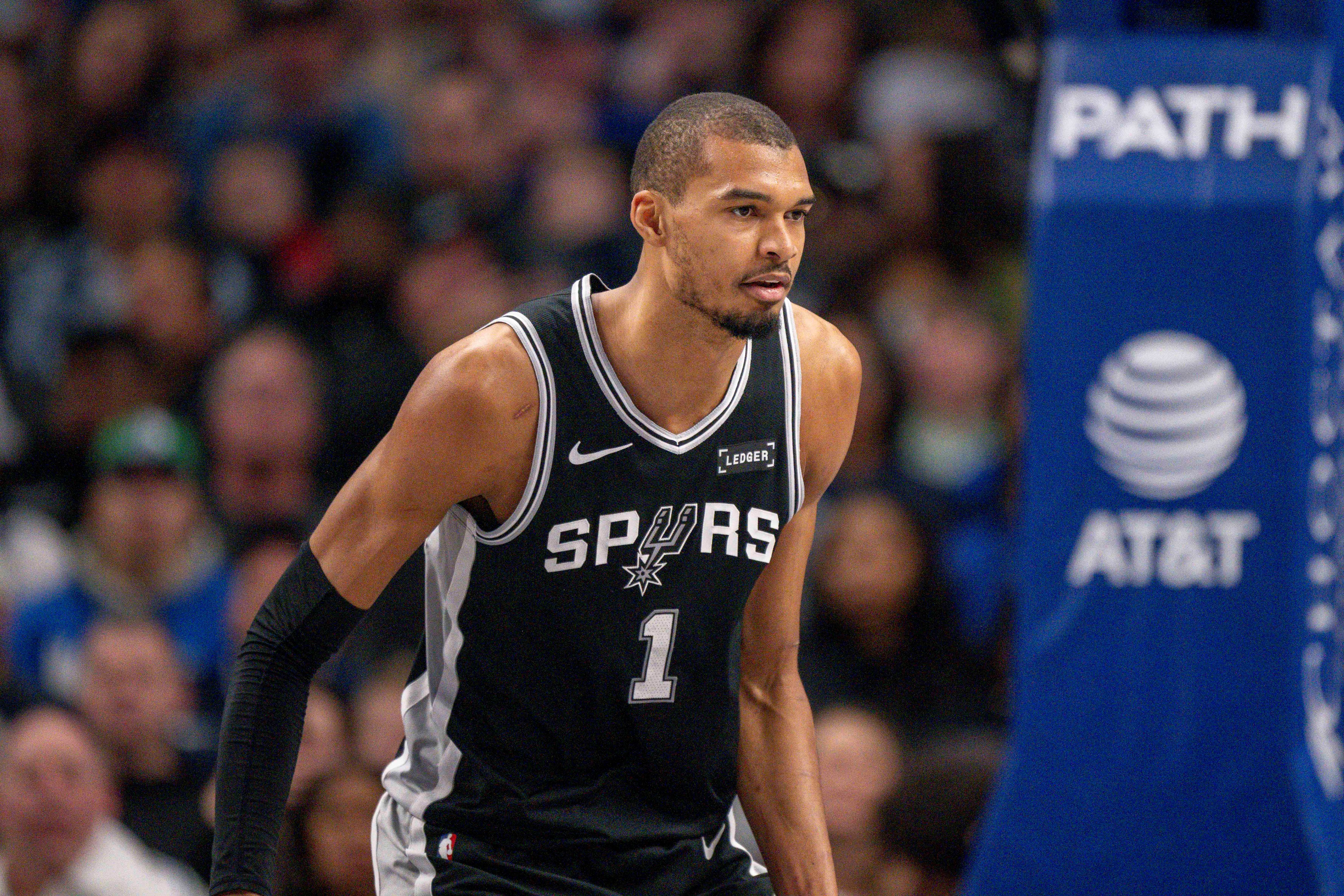 San Antonio Spurs forward Victor Wembanyama (1), seen here looking on during a game, is featured in our Spurs vs. Heat player props today.