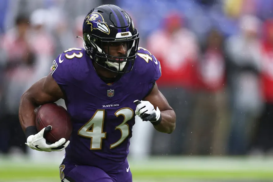 Justice Hill of the Baltimore Ravens warms up prior to the game against the Los Angeles Rams, and we offer our top Dolphins vs. Ravens prediction based on the best NFL odds.