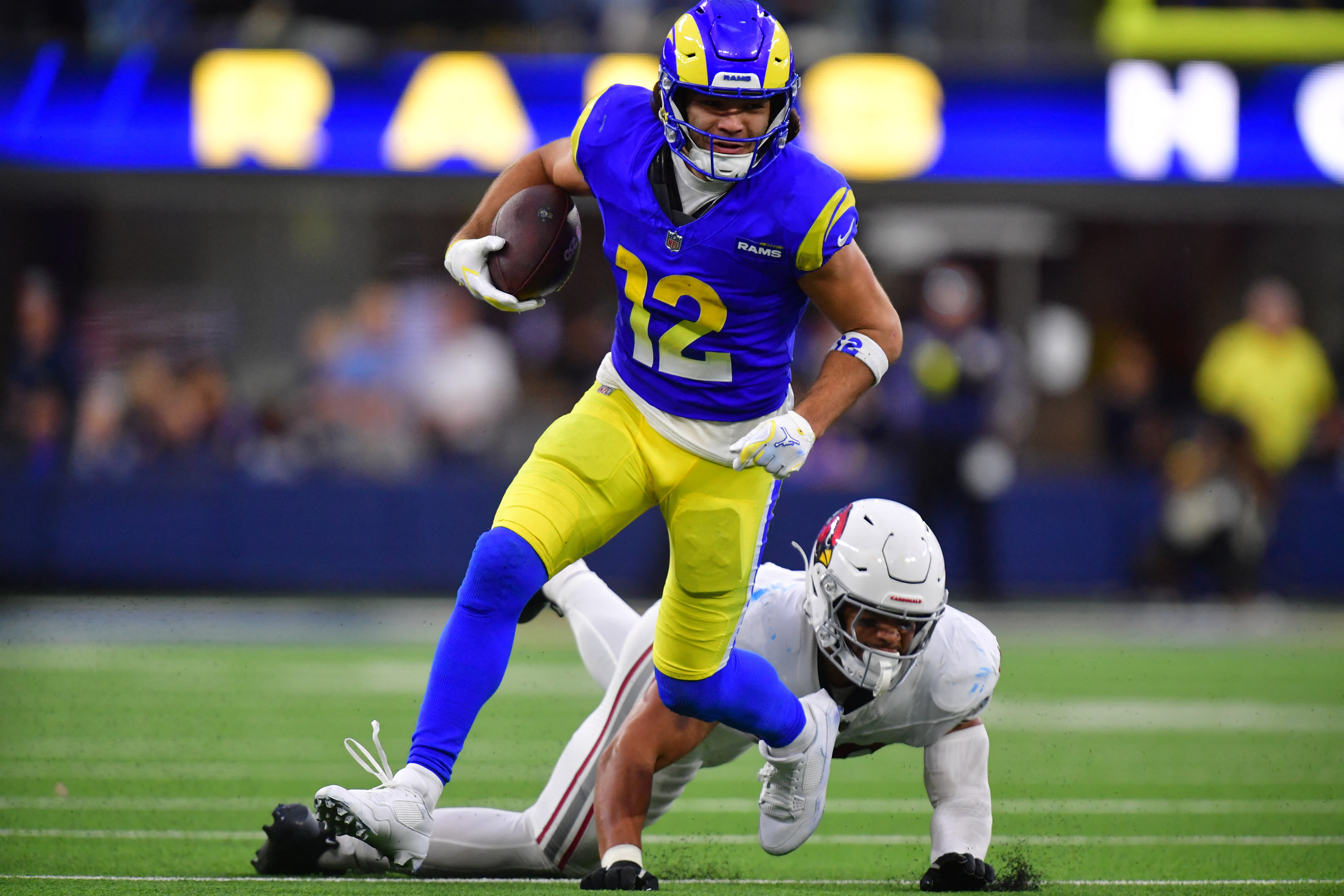 Los Angeles Rams wide receiver Puka Nacua (12) runs after the catch as we break down our Rams vs. Panthers predictions & odds for Wild Card Round.