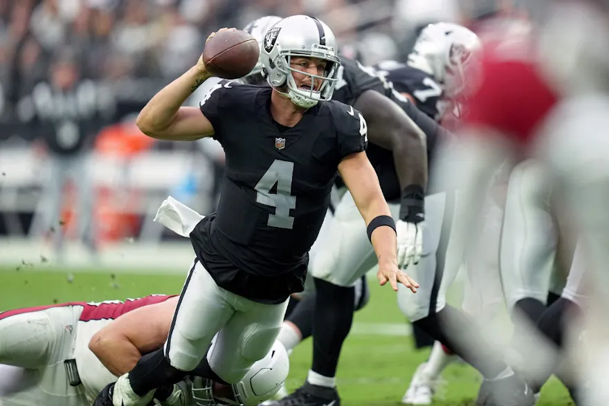 Derek Carr #4 of the Las Vegas Raiders is tackled in the second half against the Arizona Cardinals at Allegiant Stadium on Sept. 18.