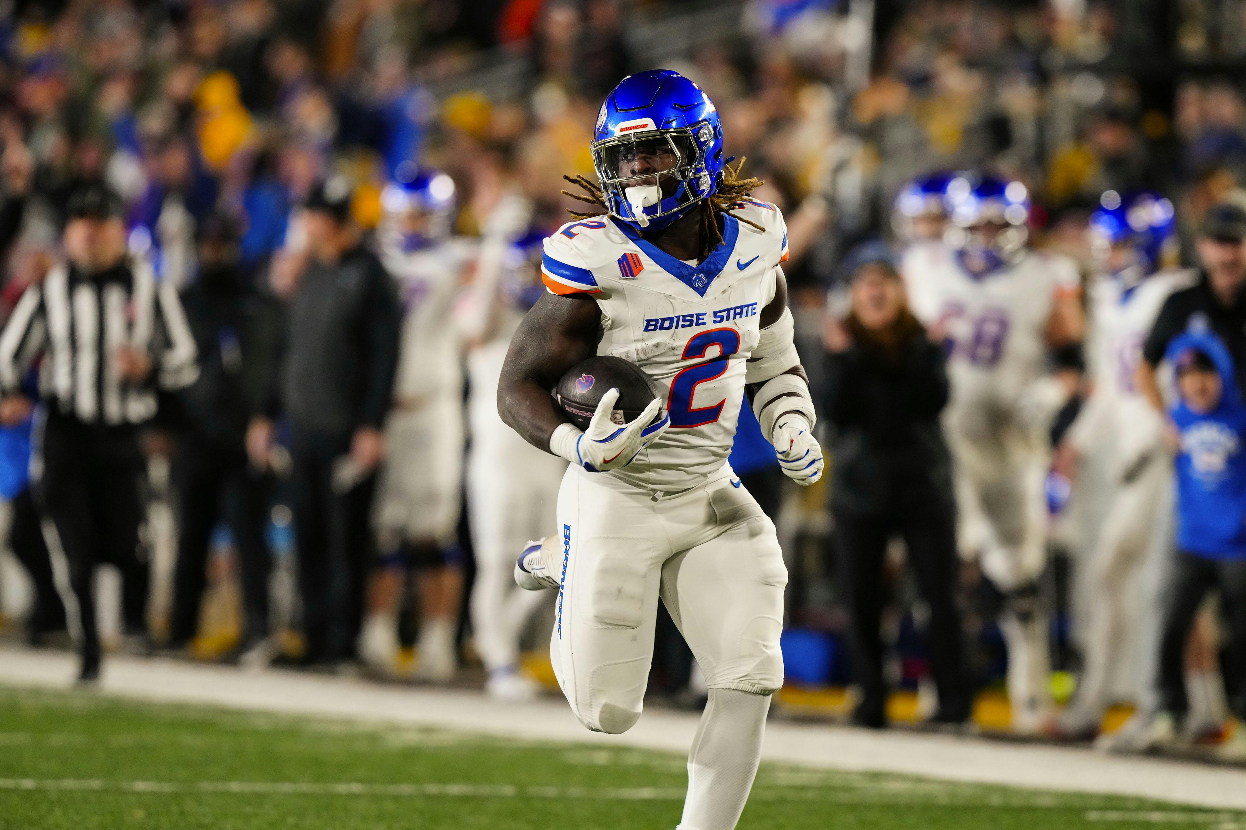 Boise State running back Ashton Jeanty runs for a touchdown against Wyoming. Boise State leads the G5 College Football Playoff odds.