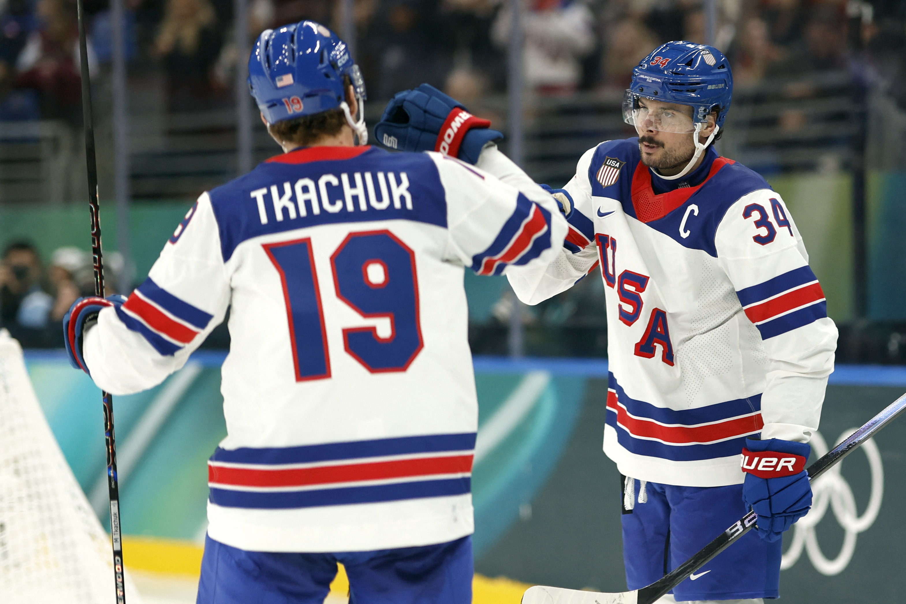 USA's Auston Matthews (right) and Matthew Tkachuk (left) celebrate a goal as we offer our USA vs. Sweden prediction.