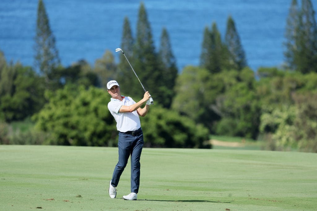Justin Thomas of the United States plays a second shot on the fourth hole during the first round of the Sentry Tournament of Champions at Plantation Course at Kapalua Golf Club on January 05, 2023 in Lahaina, Hawaii. Photo by Andy Lyons/Getty Images via AFP.