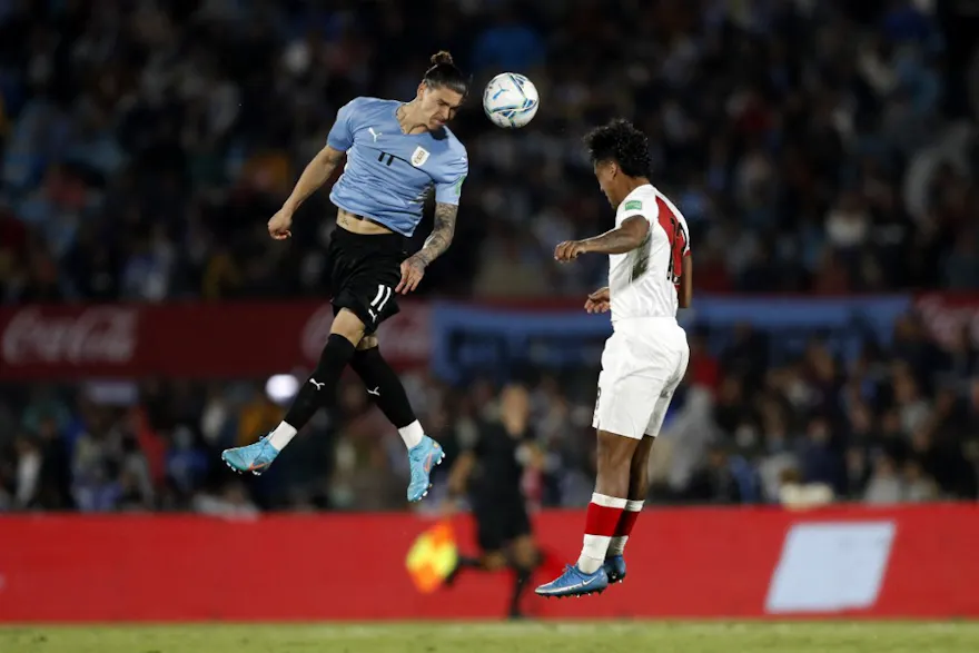 Uruguay's Darwin Nunez and Peru's Renato Tapia vie for the ball during their South American qualification football match.