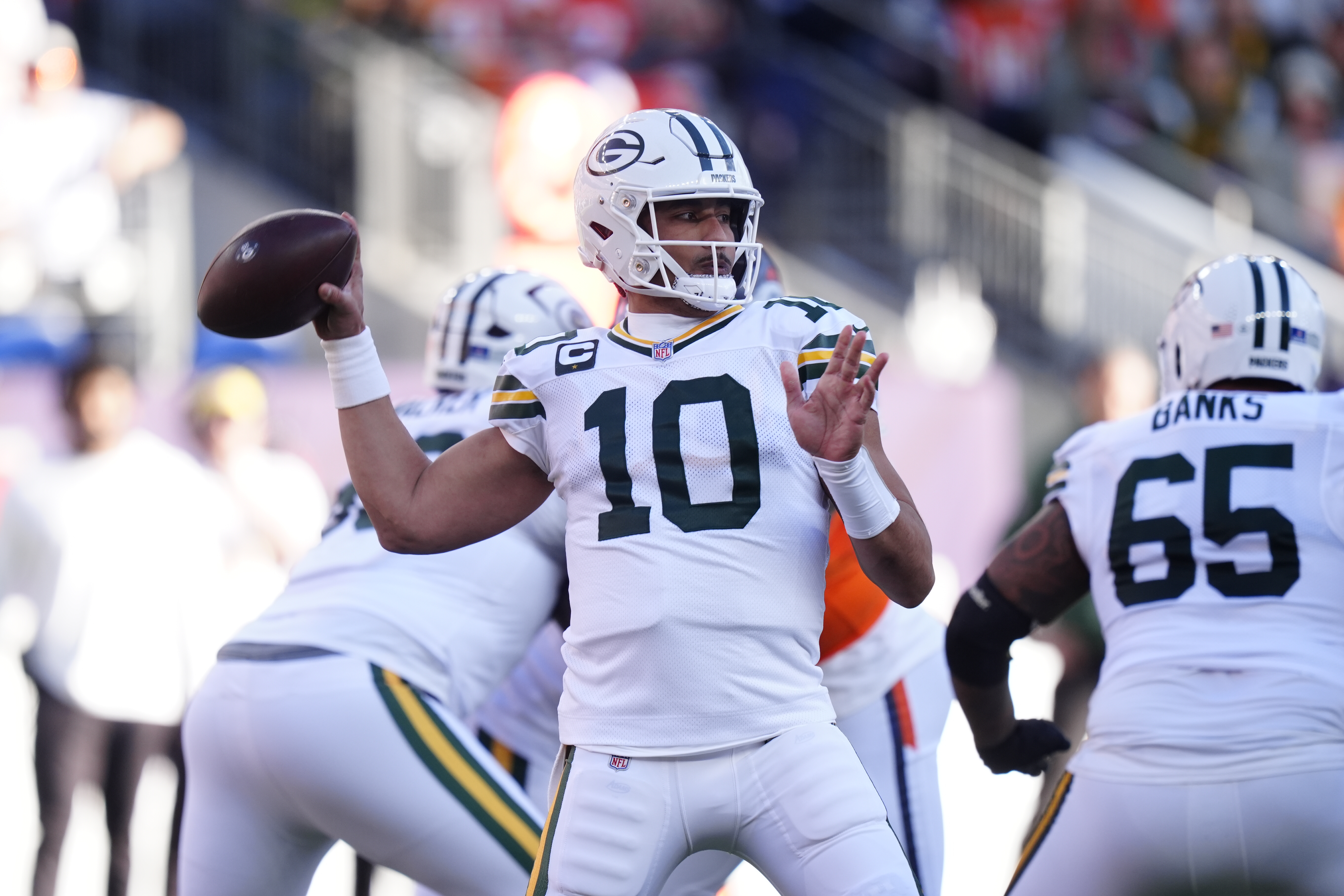 Green Bay Packers quarterback Jordan Love (10) throws downfield as we dive into our Packers vs. Bears predictions.