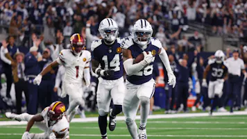 DaRon Bland #26 of the Dallas Cowboys returns an interception for a touchdown as we look at his best odds to win NFL Defensive Player of the Year.