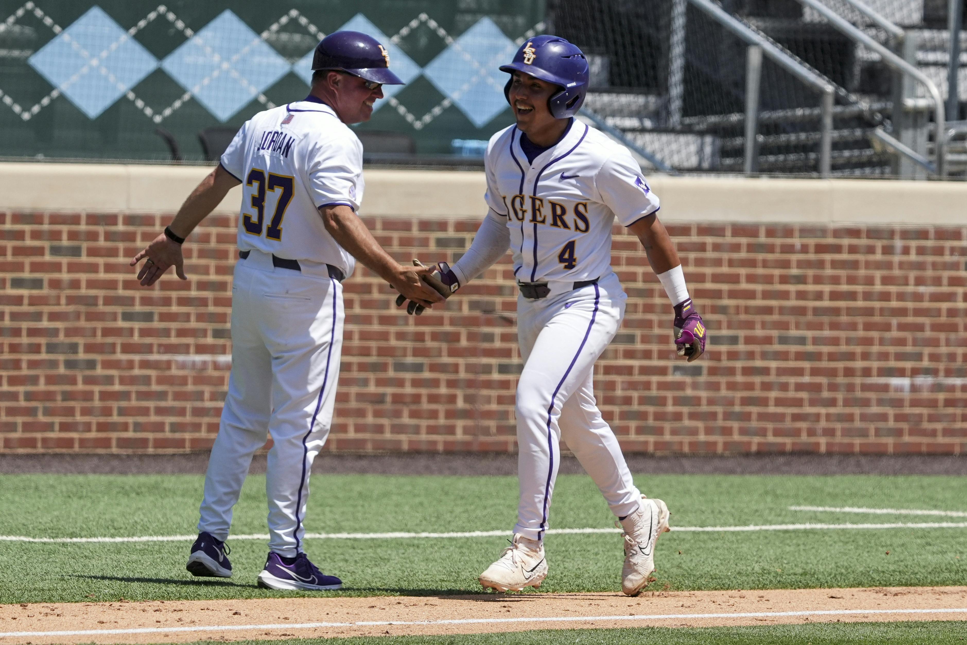 LSU infielder Steven Milam (4) celebrates his winning home run as we look at the College World Series odds.