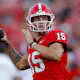 Carson Beck of the Georgia Bulldogs warms up prior to the game against the UAB Blazers at Sanford Stadium as we look at our college football parlay picks.