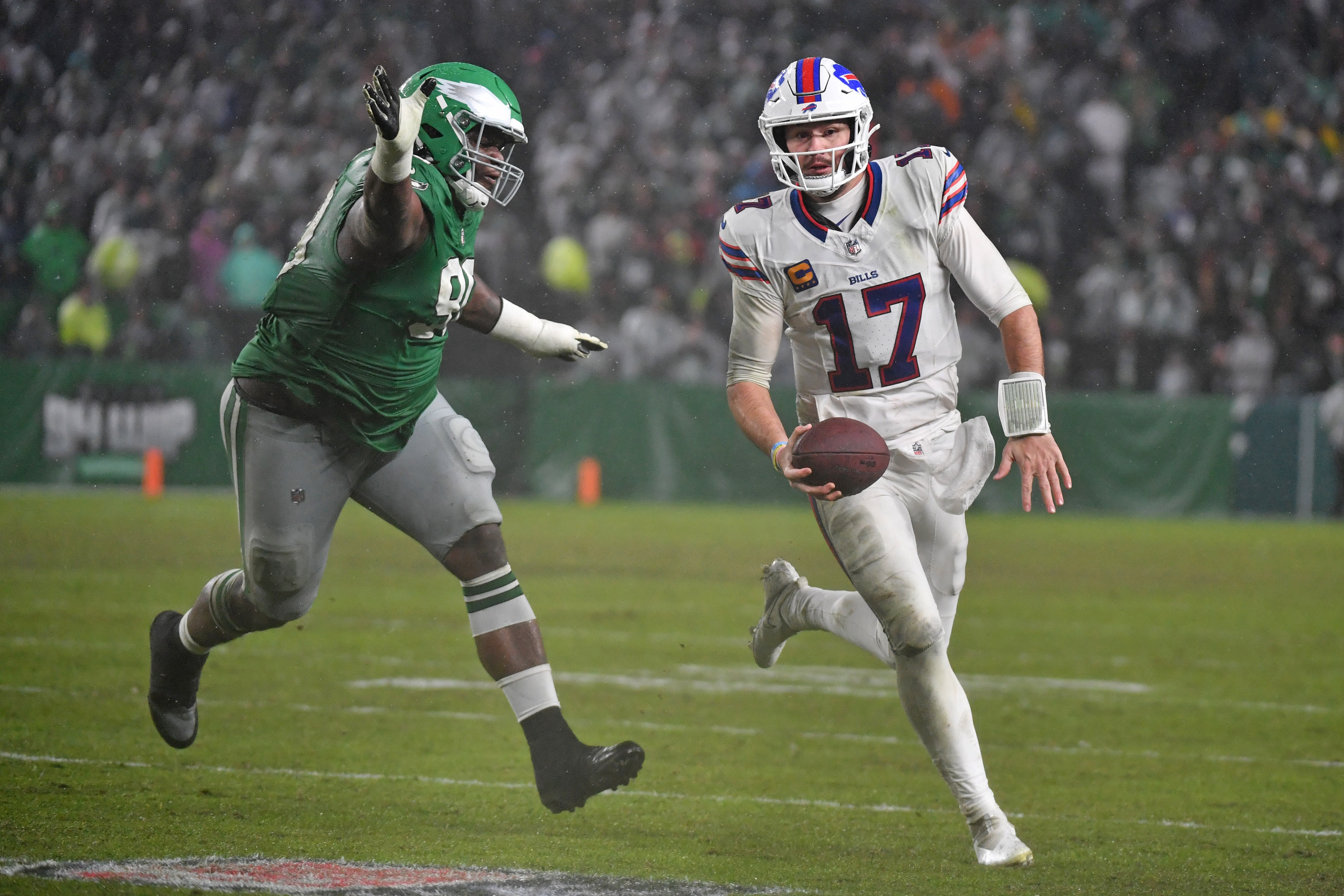 Buffalo Bills quarterback Josh Allen (17) scrambles as we break down the NFL weather report for Week 17.
