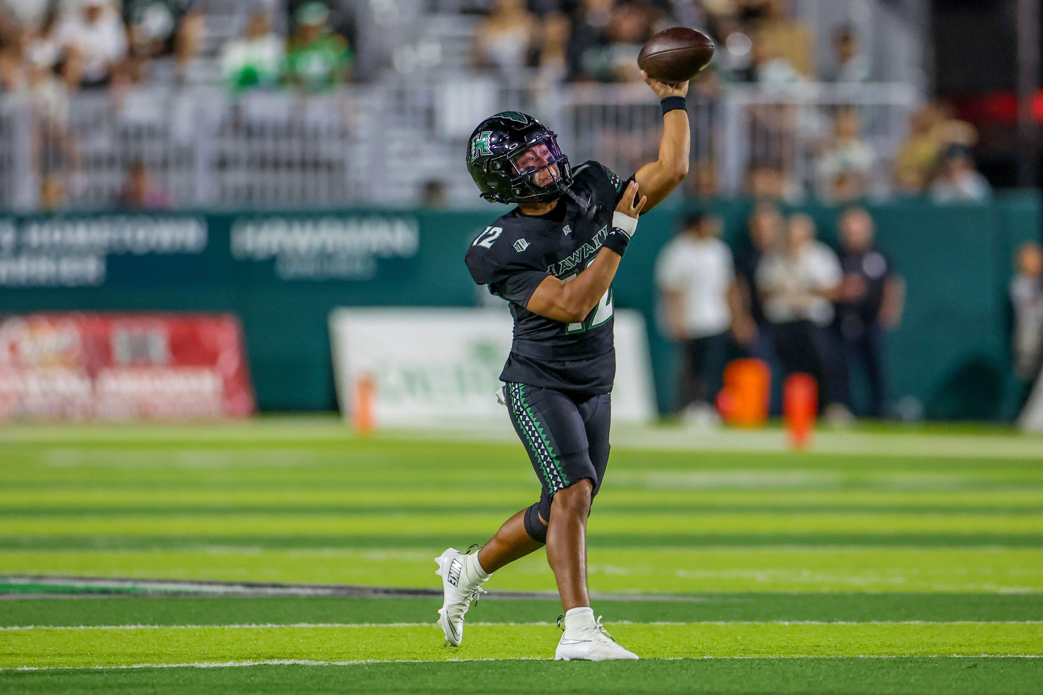 Hawaii Rainbow Warriors quarterback Micah Alejado (12) makes a pass as he is featured in our Cal vs. Hawaii anytime touchdown scorer predictions.